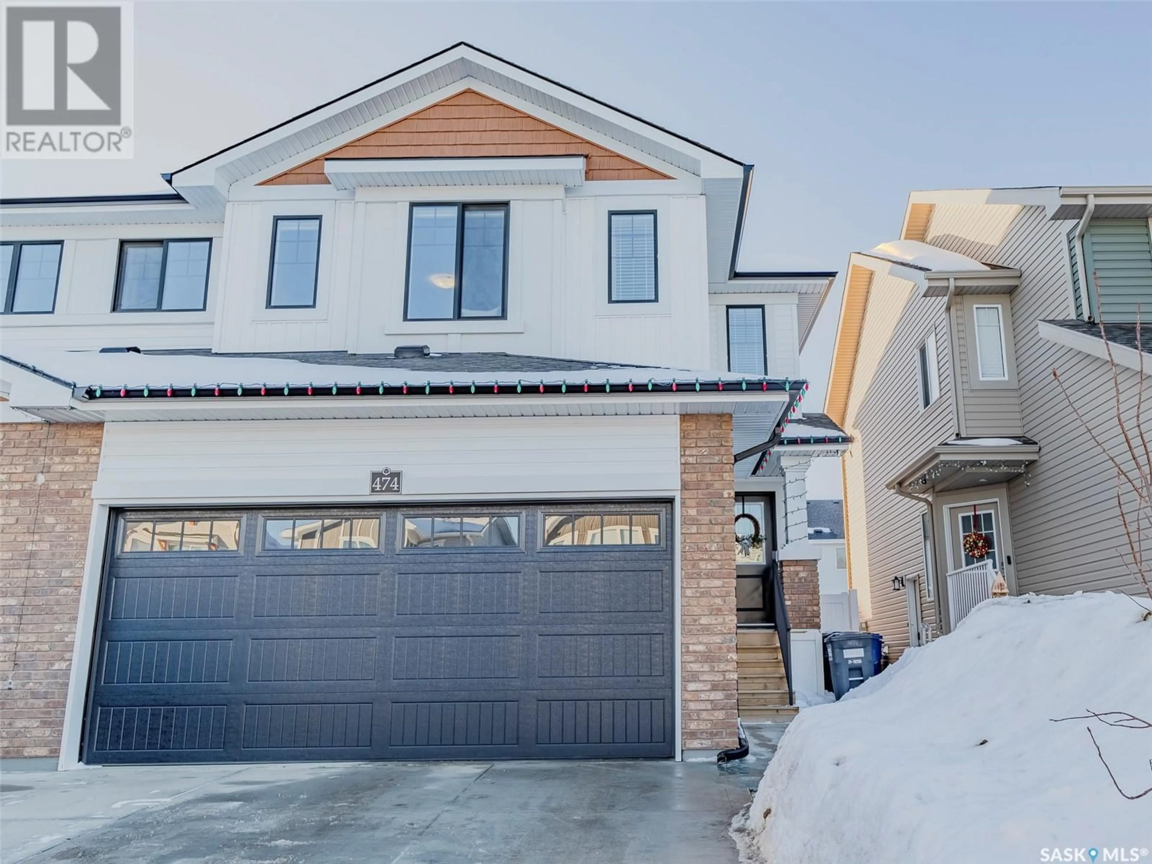 Home with brick exterior material, street for 474 Schmeiser BEND, Saskatoon Saskatchewan