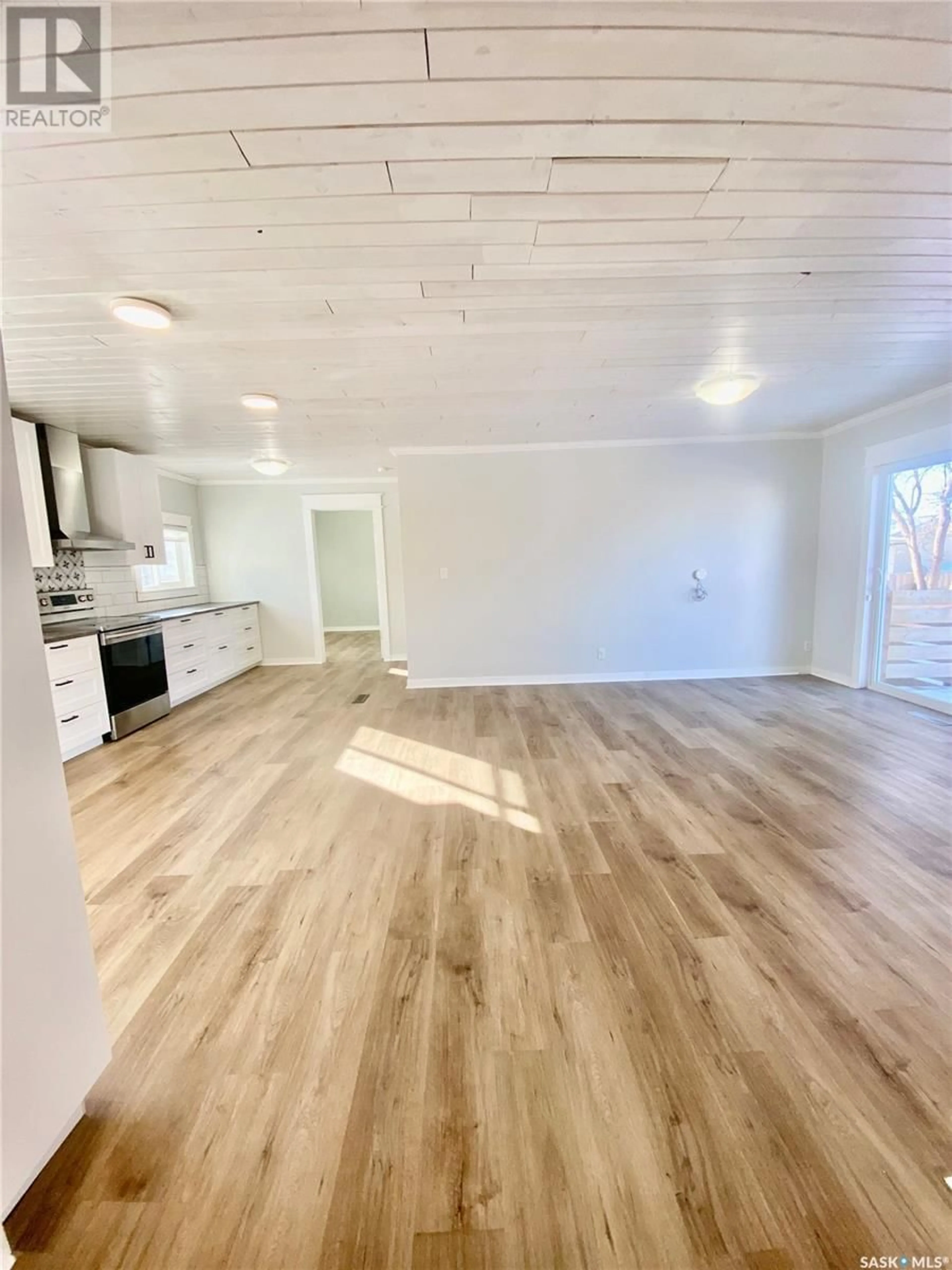 Open concept kitchen, wood/laminate floor for 102 MISSOURI COTEAU STREET, Avonlea Saskatchewan S0H0C0
