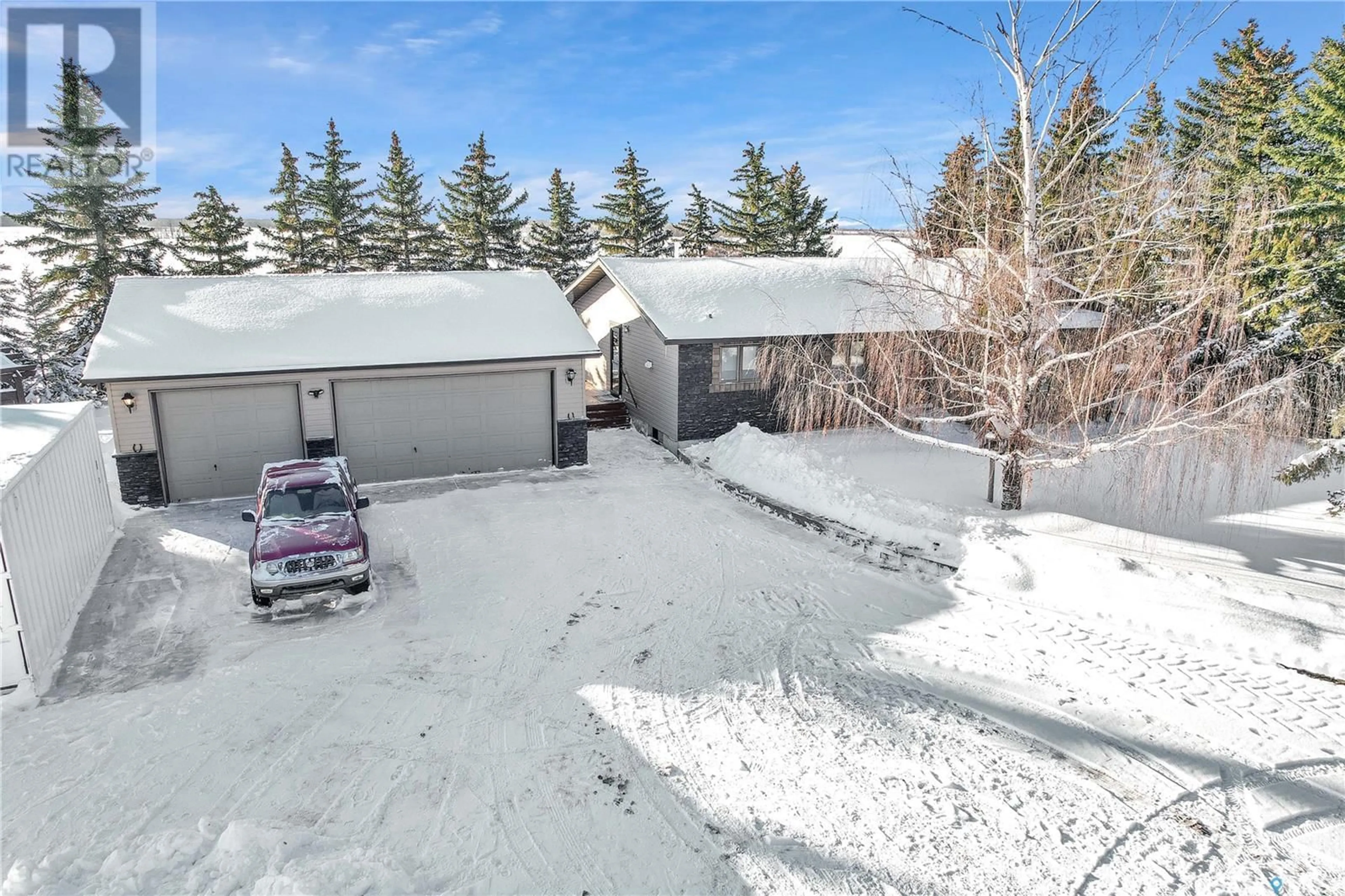 A pic from outside/outdoor area/front of a property/back of a property/a pic from drone, street for Saskatoon Spruce Acres, Corman Park Rm No. 344 Saskatchewan S7K1P3