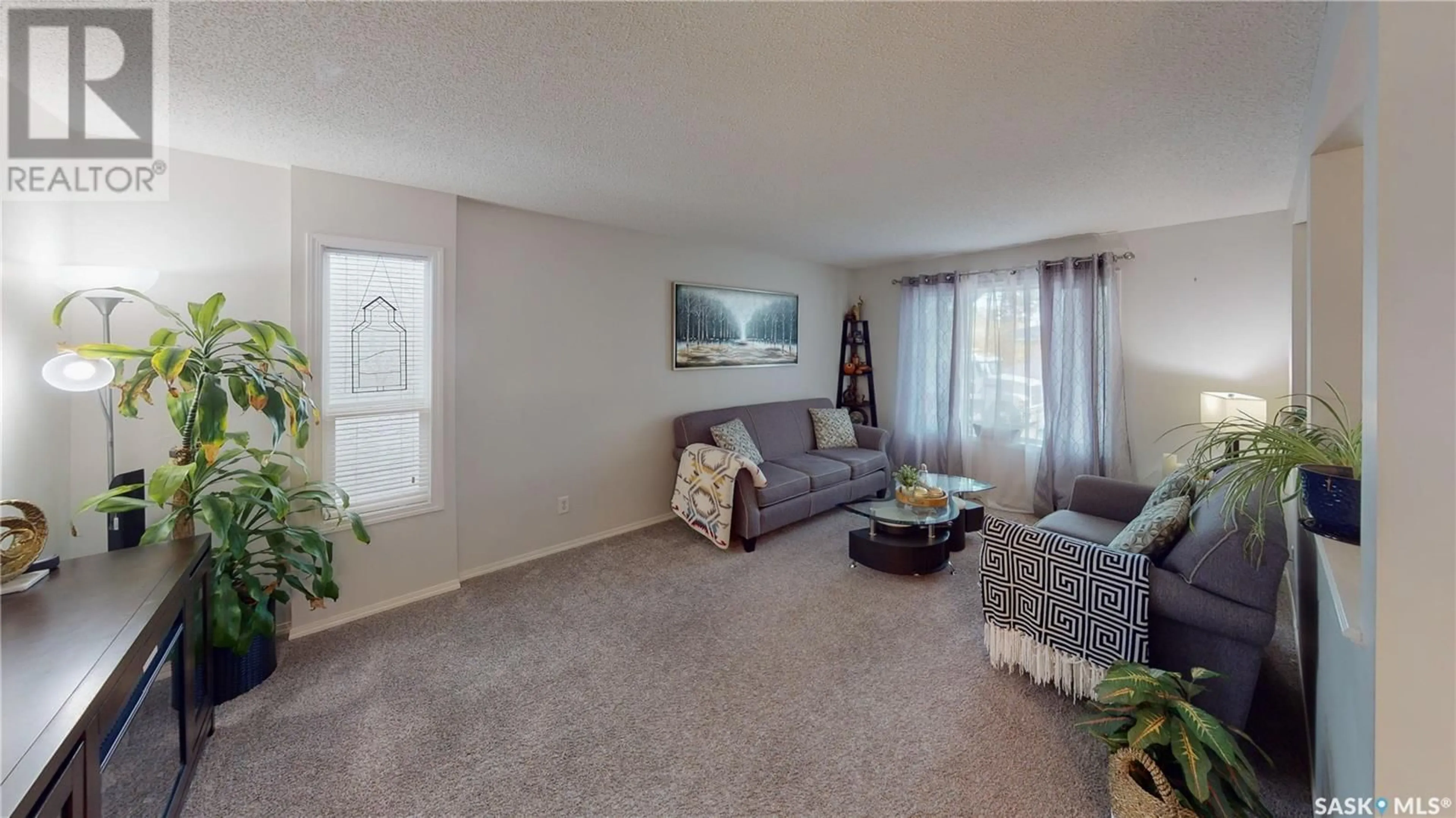 Living room with furniture, carpet floor for 412 Retallack STREET, Regina Saskatchewan S4R3N3