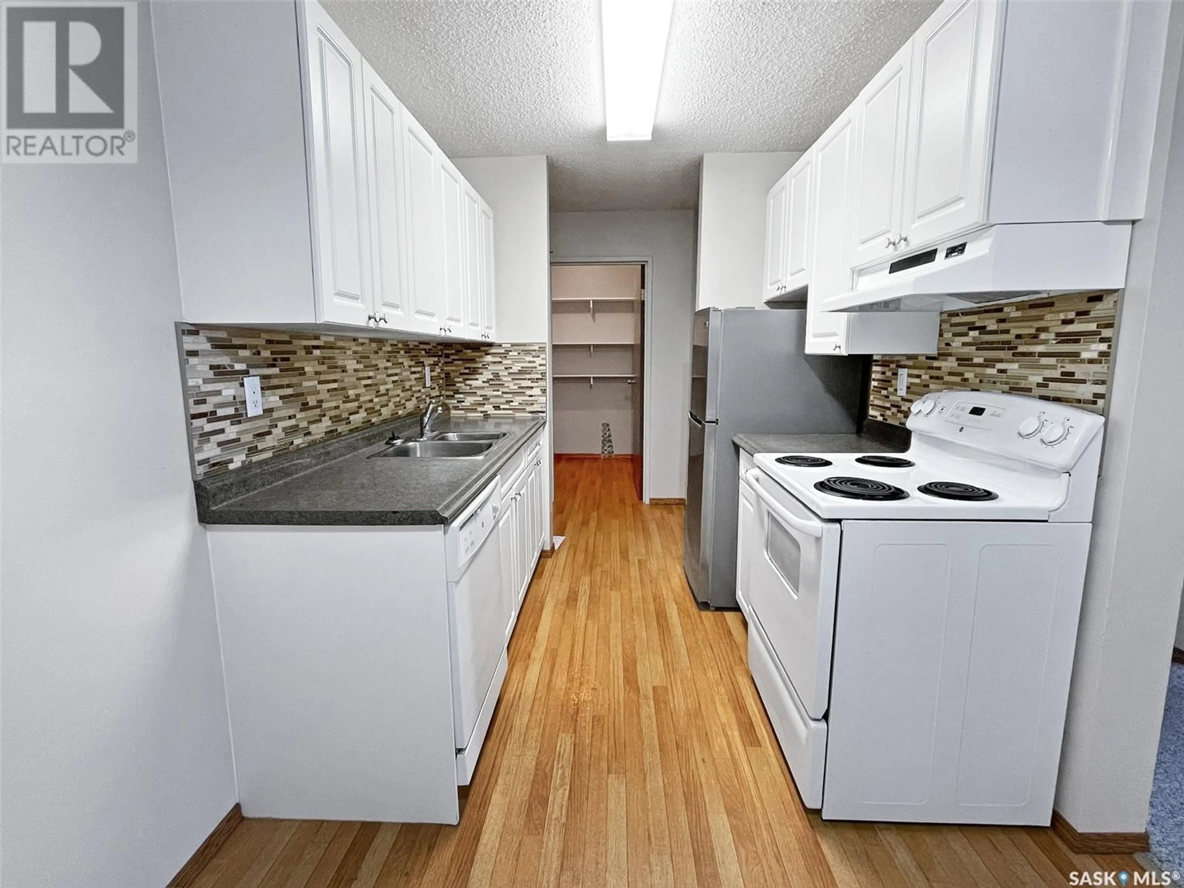 Standard kitchen, wood/laminate floor for 104 1110 9th AVENUE NE, Swift Current Saskatchewan S9H2S9