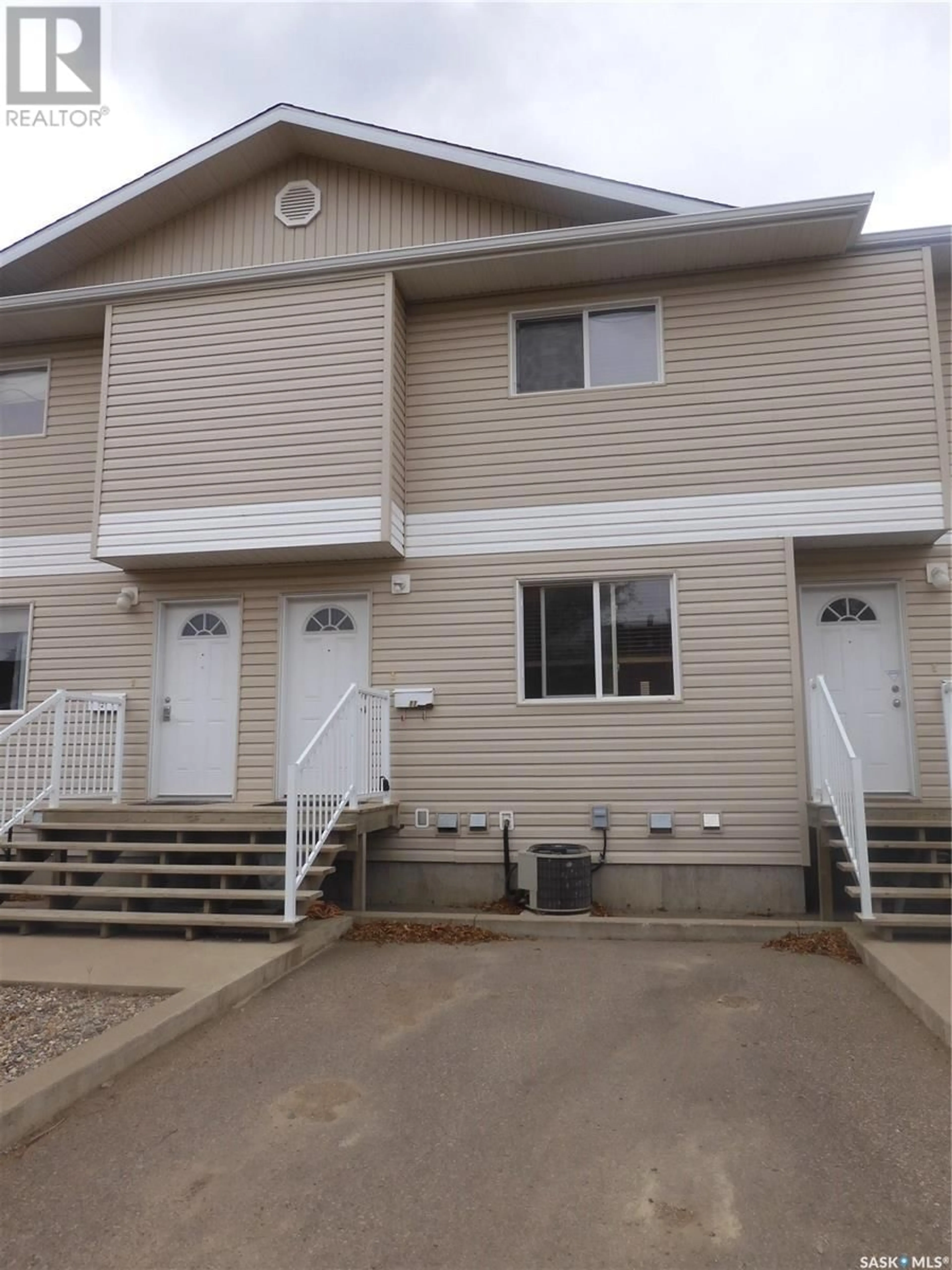 Home with vinyl exterior material, street for 11 1437 1st STREET, Estevan Saskatchewan S4A2X5