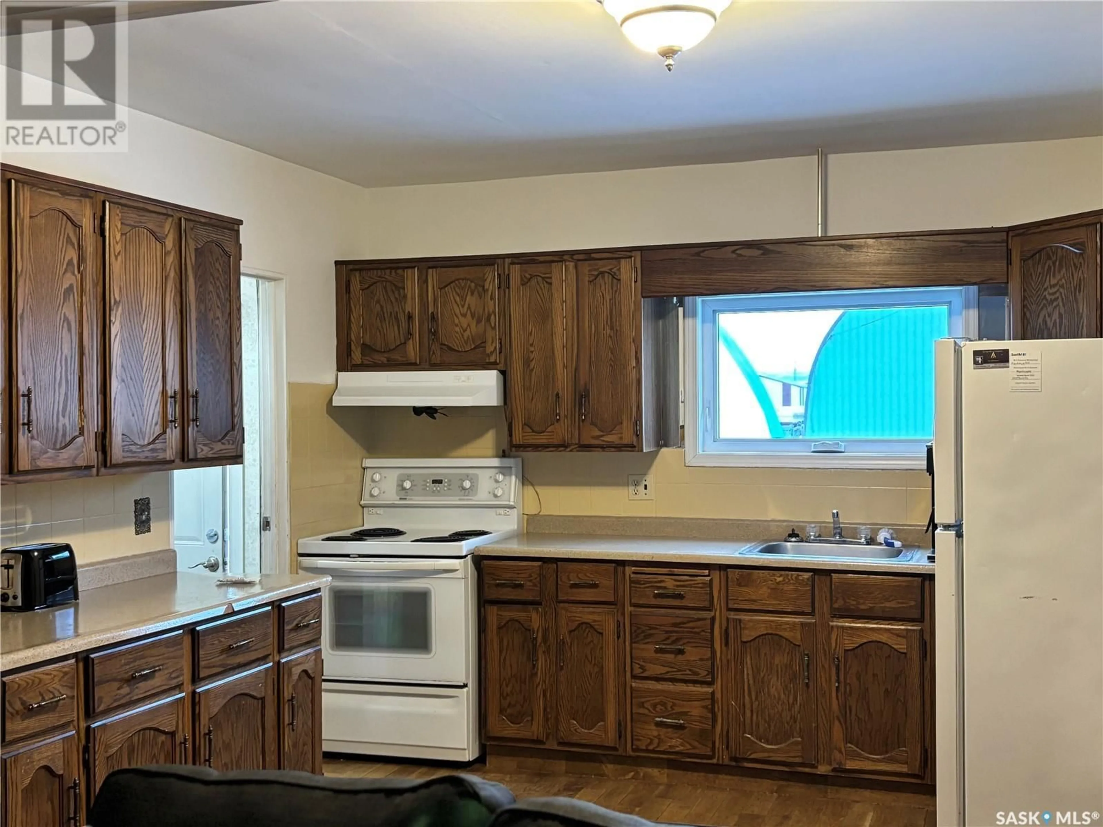 Standard kitchen, wood/laminate floor for 923 4th STREET, Estevan Saskatchewan S4A0W2