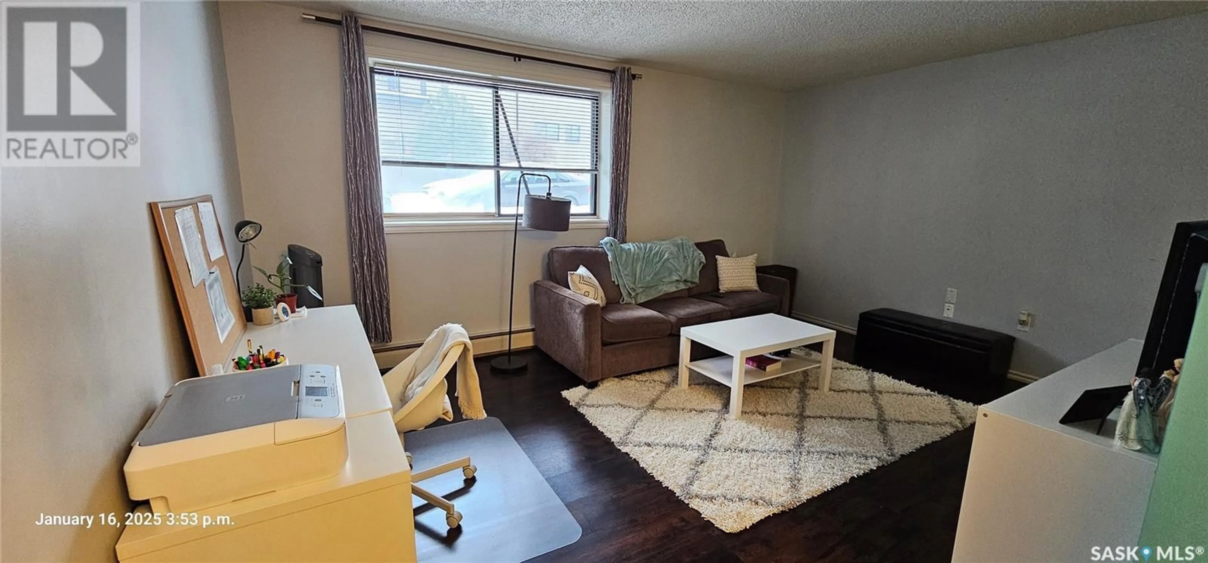 Living room with furniture, wood/laminate floor for 106 250 Pinehouse DRIVE, Saskatoon Saskatchewan S7K4X1