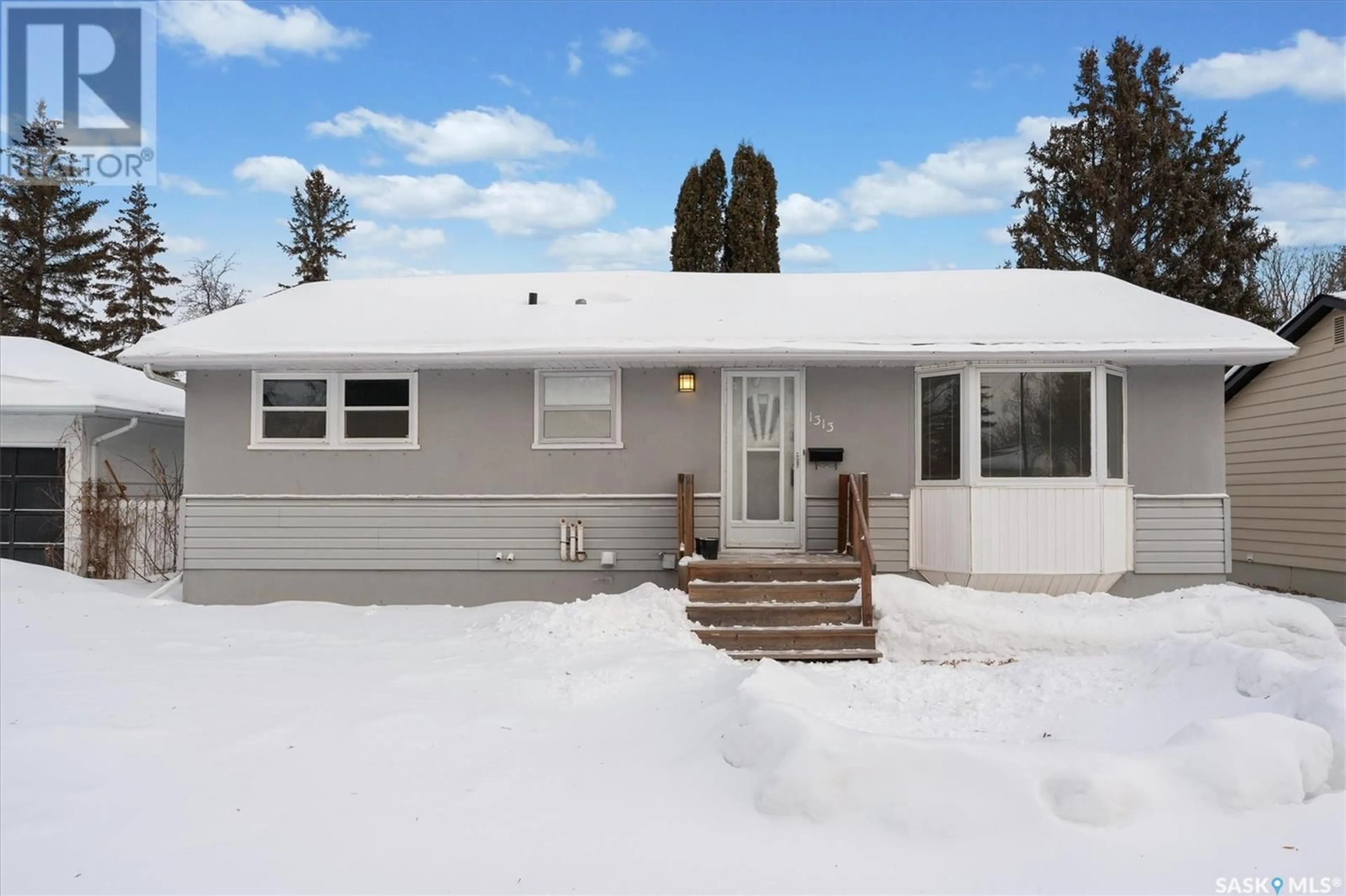 Home with vinyl exterior material, street for 1313 10th STREET E, Saskatoon Saskatchewan S7H0T2