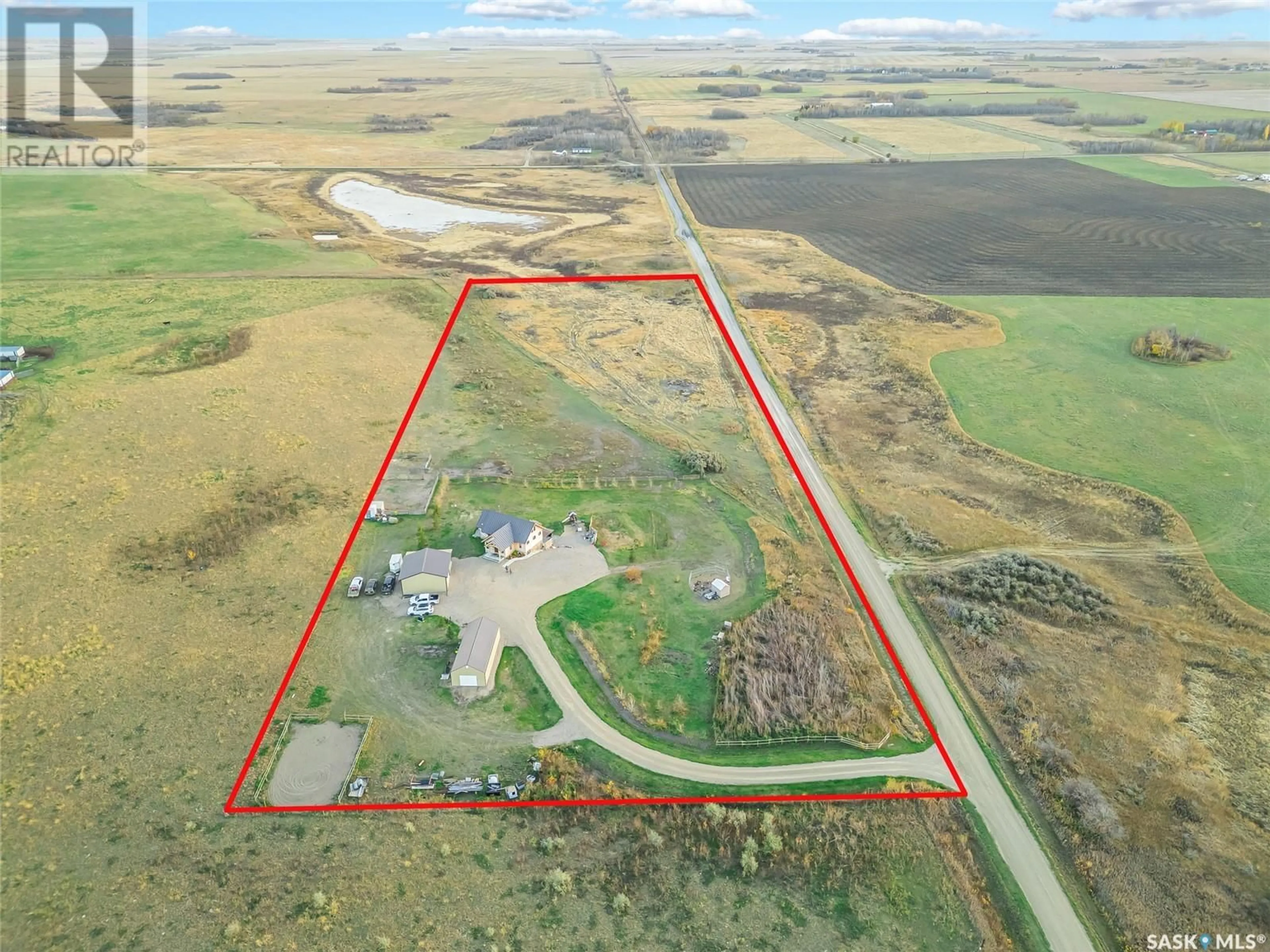 A pic from outside/outdoor area/front of a property/back of a property/a pic from drone, building for Cooke Acreage - Auction Mart Rd, Corman Park Rm No. 344 Saskatchewan S7K3J5