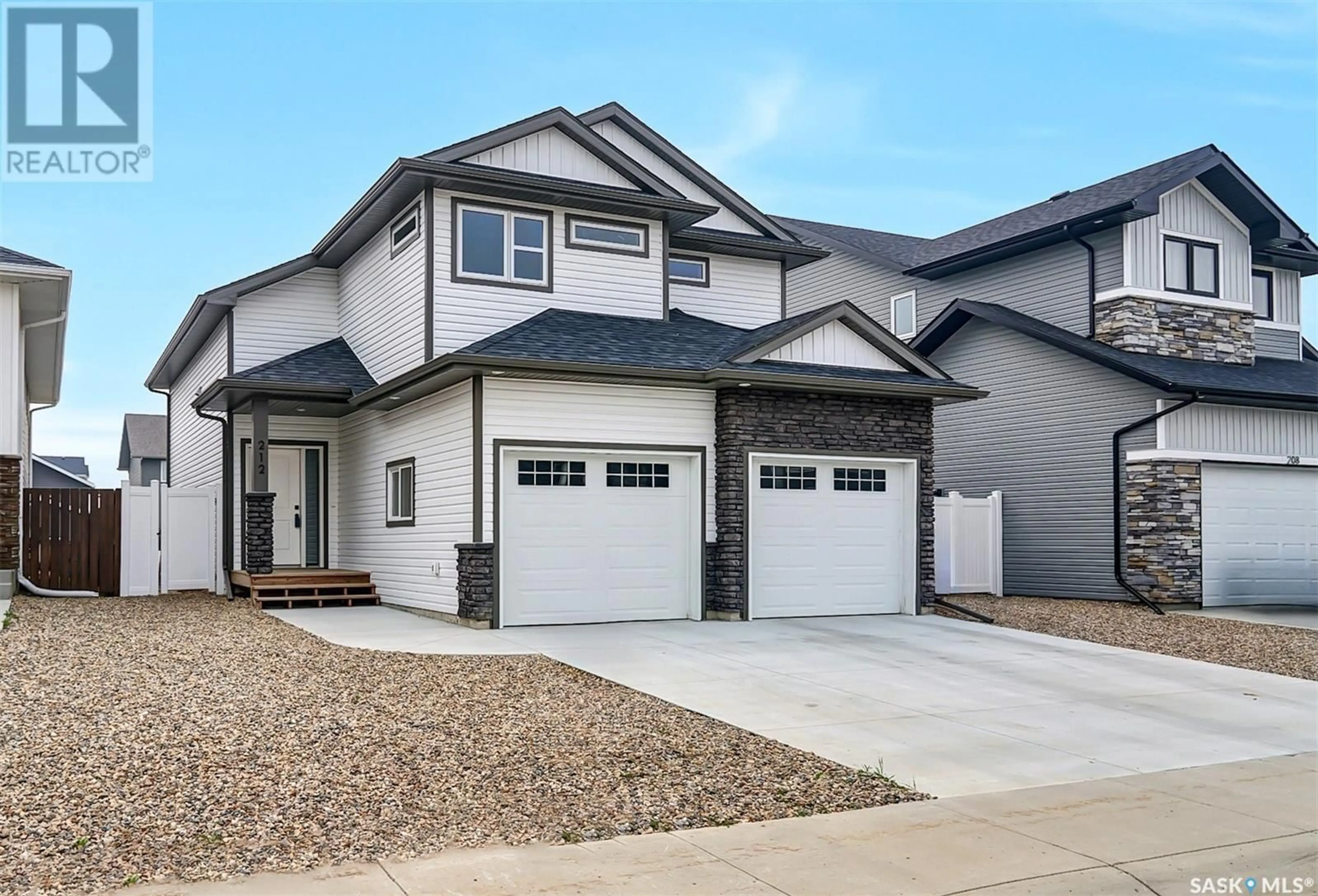 Home with vinyl exterior material, street for 212 Cowan CRESCENT, Martensville Saskatchewan S0K2T1