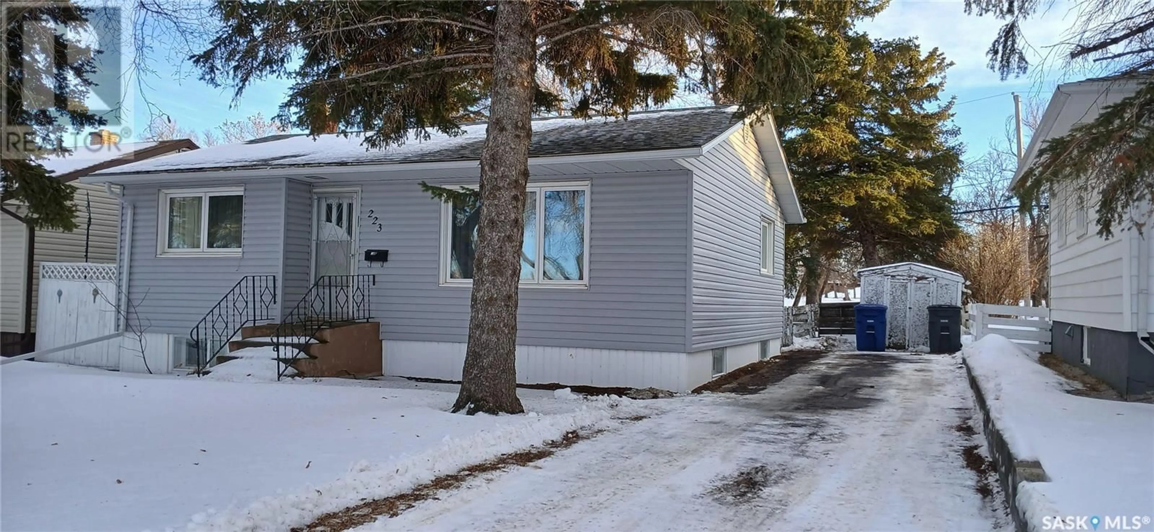 Home with vinyl exterior material, street for 223 DOMINION ROAD, Assiniboia Saskatchewan S0H0B0