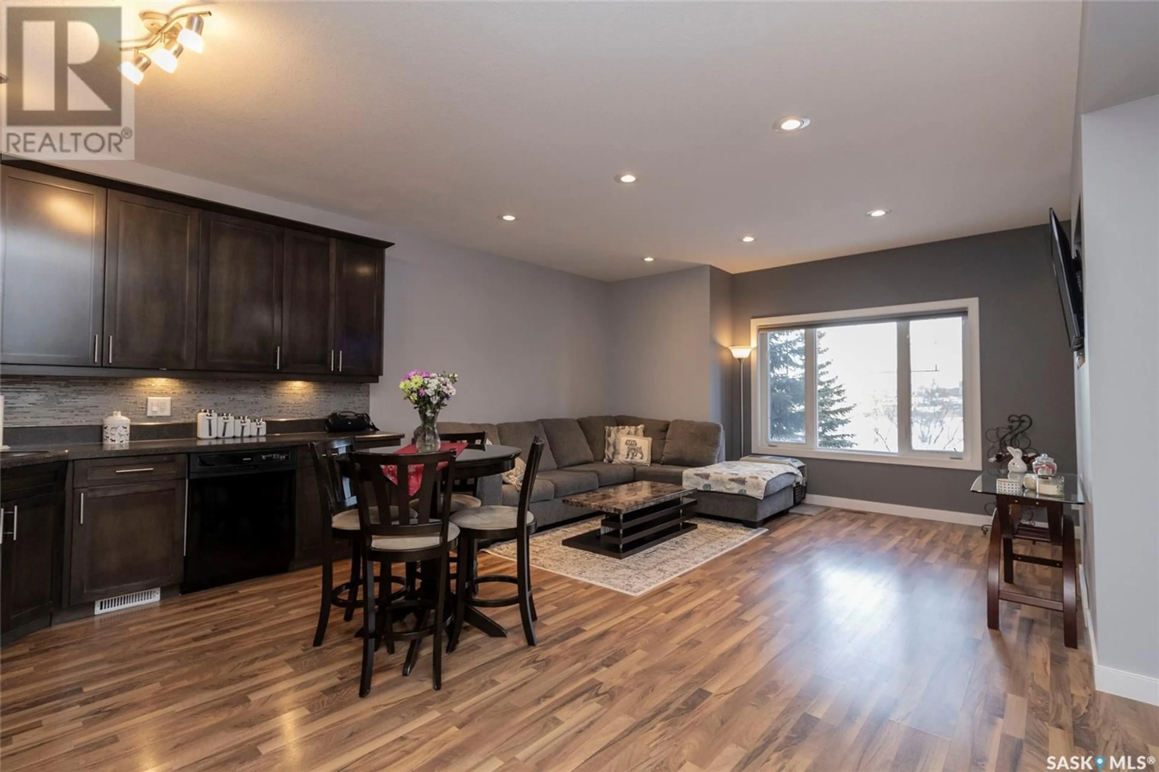 Living room with furniture, wood/laminate floor for 29 215 Hampton GREEN, Saskatoon Saskatchewan S7R0G7