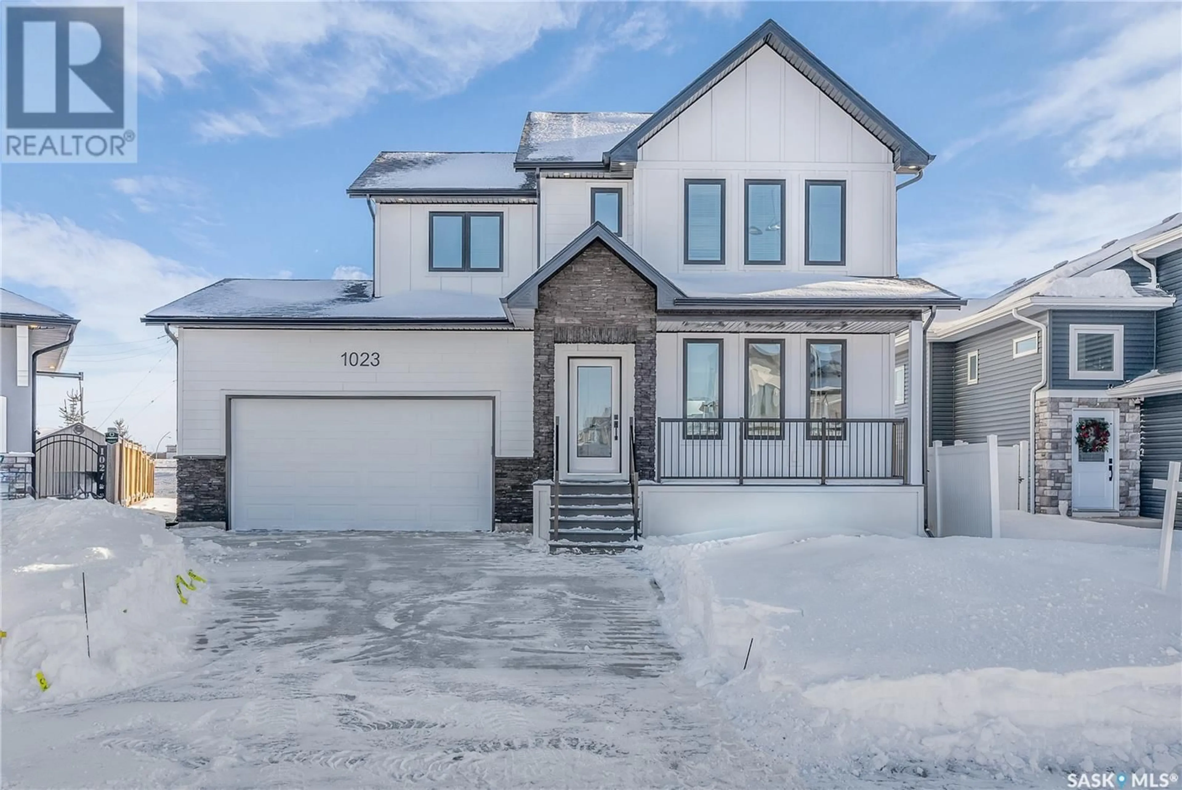 Home with brick exterior material, street for 1023 Glacial Shores COMMON, Saskatoon Saskatchewan S7W0R3