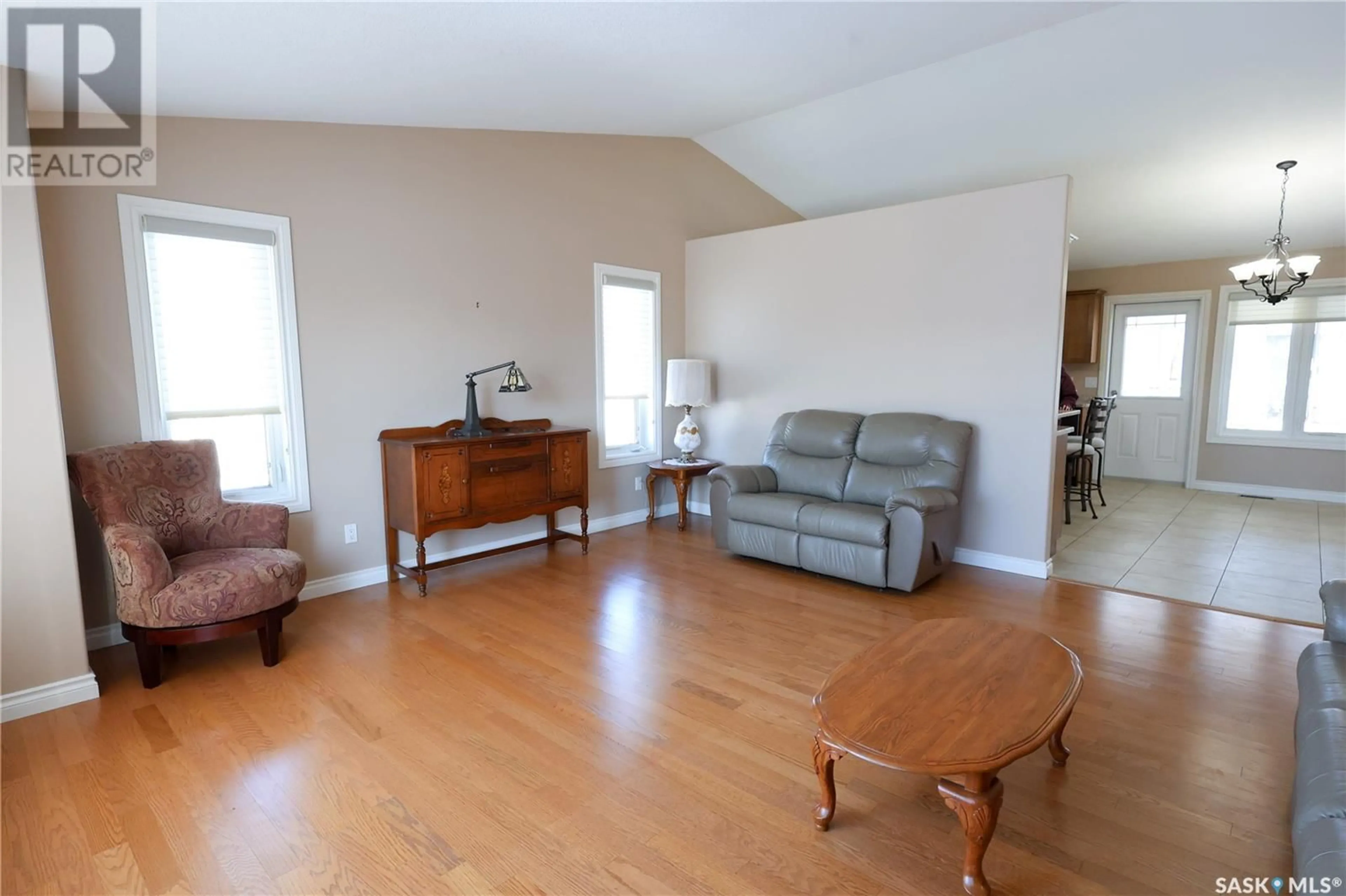 Living room with furniture, wood/laminate floor for 20 Damour TERRACE, Prince Albert Saskatchewan S6X1C9