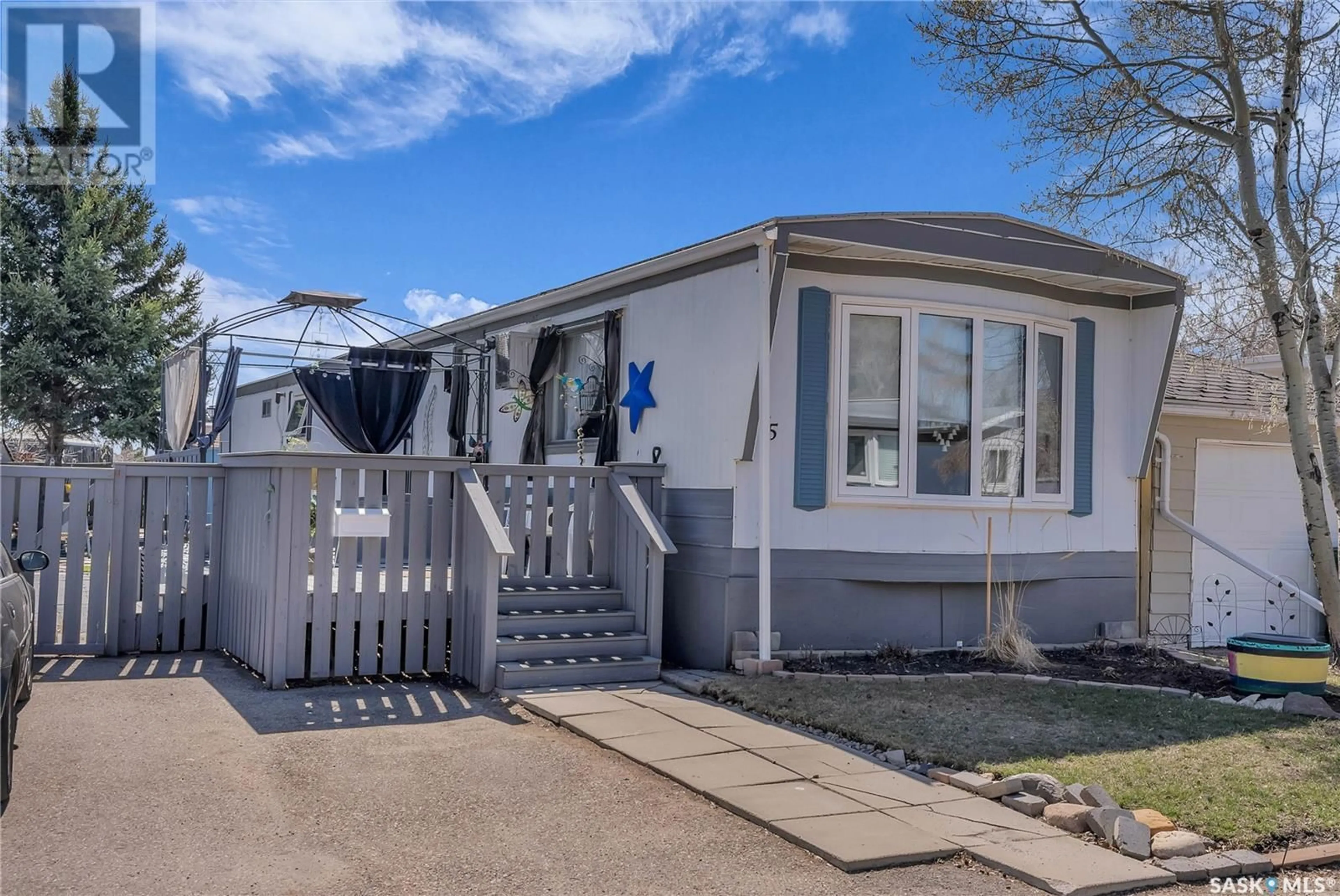 Home with vinyl exterior material, street for 75 1035 Boychuk DRIVE, Saskatoon Saskatchewan S7H5B2