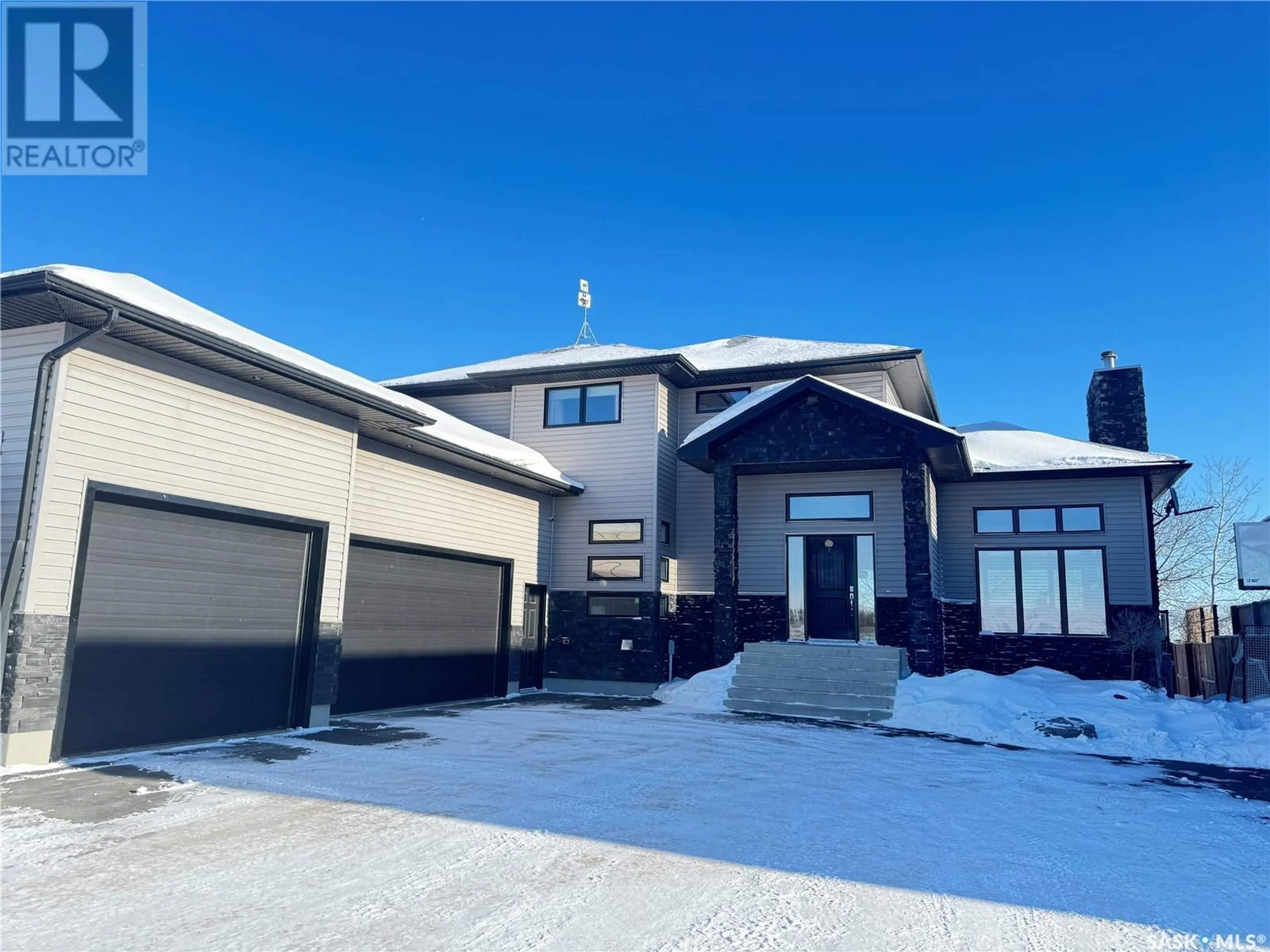 Home with vinyl exterior material, street for 14 HUMBOLDT LAKE DRIVE, Humboldt Lake Saskatchewan S0K2A0
