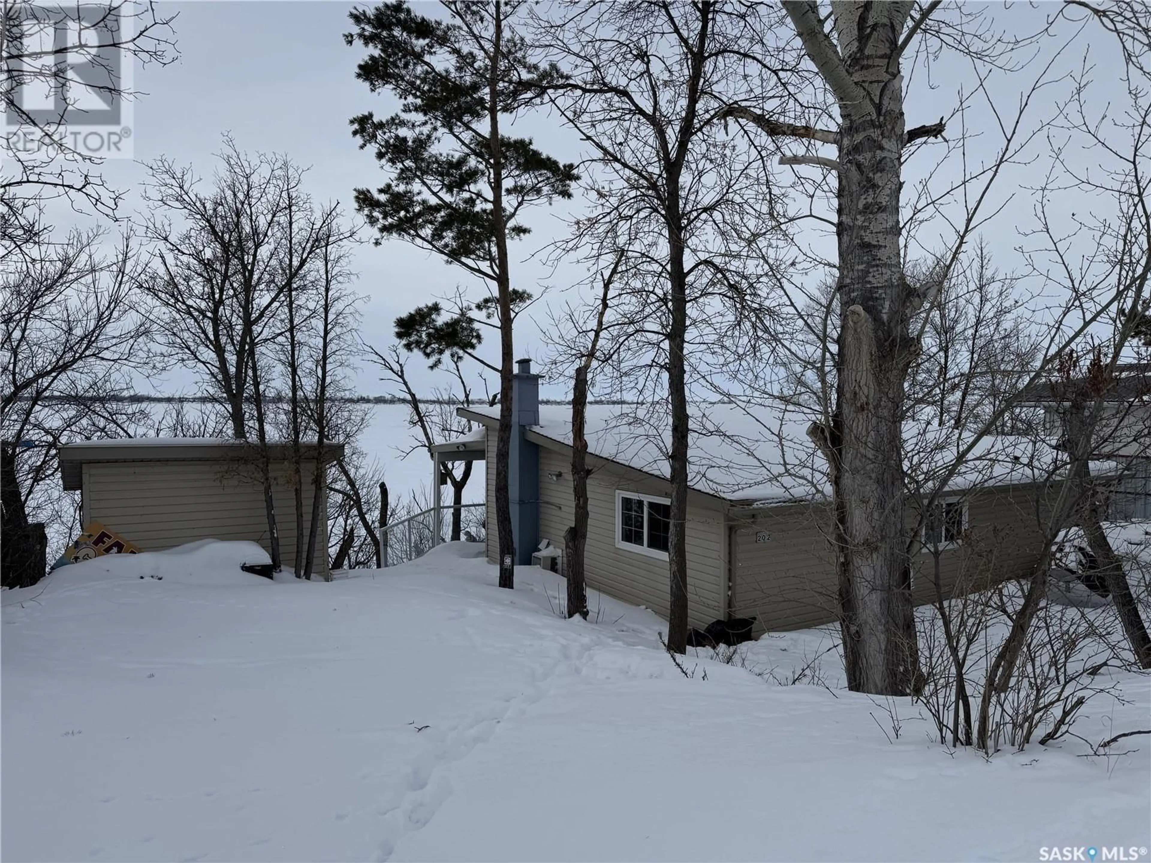 A pic from outside/outdoor area/front of a property/back of a property/a pic from drone, forest/trees view for 424 Last Mountain ROAD, Spring Bay Saskatchewan S0G4L0