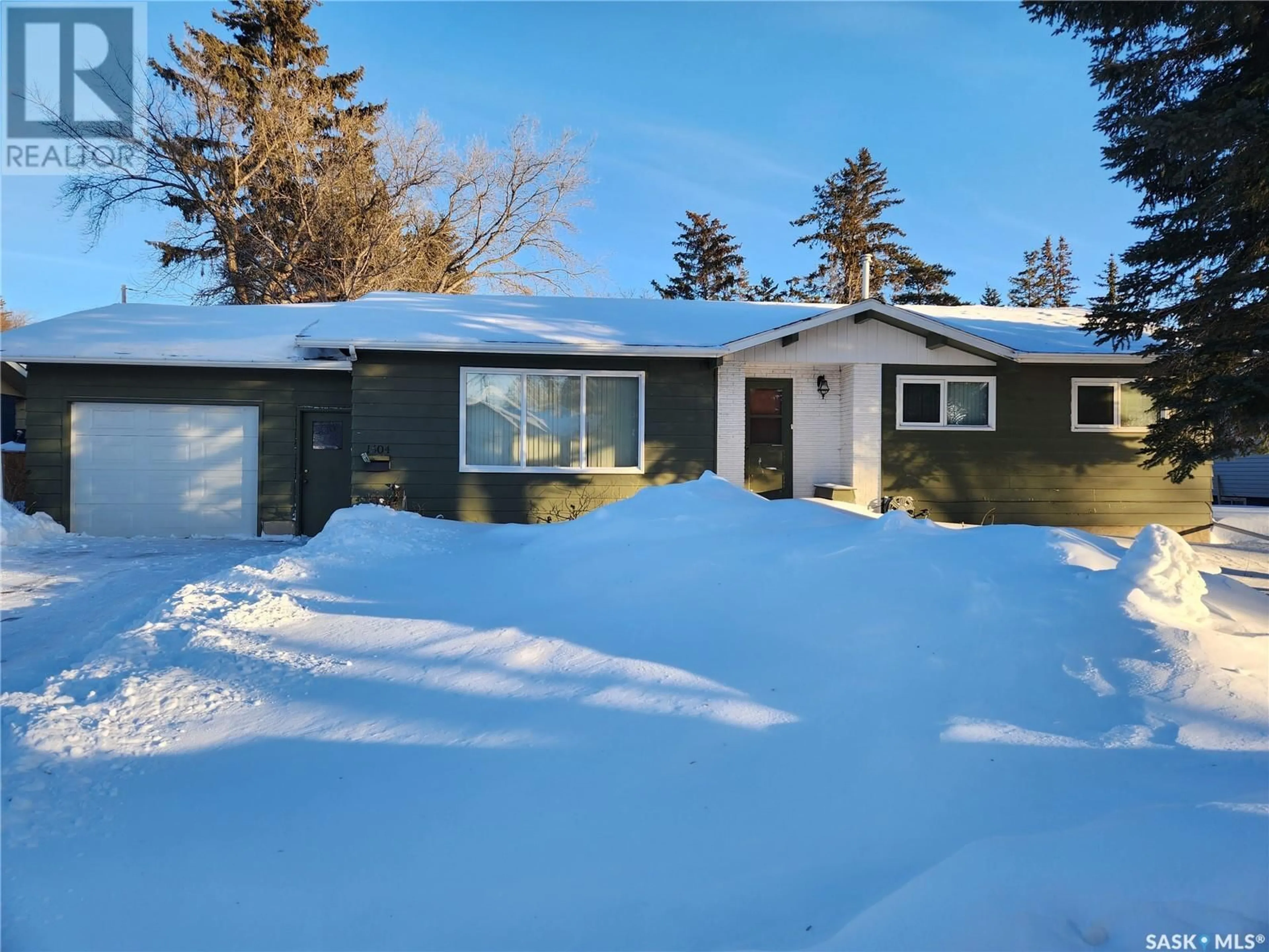 Home with vinyl exterior material, street for 1504 98th STREET, Tisdale Saskatchewan S0E1T0