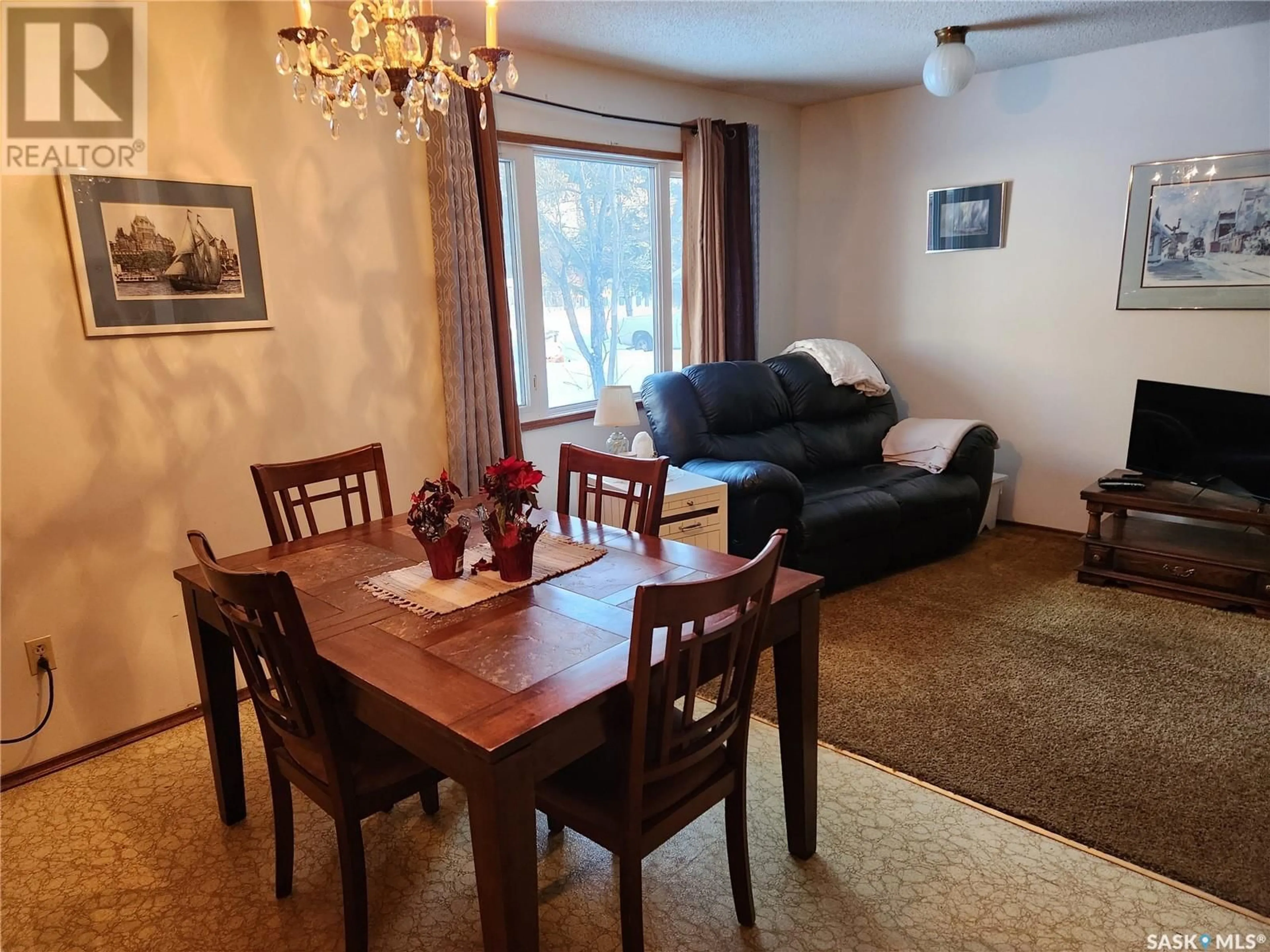 Dining room, wood/laminate floor for 1504 98th STREET, Tisdale Saskatchewan S0E1T0