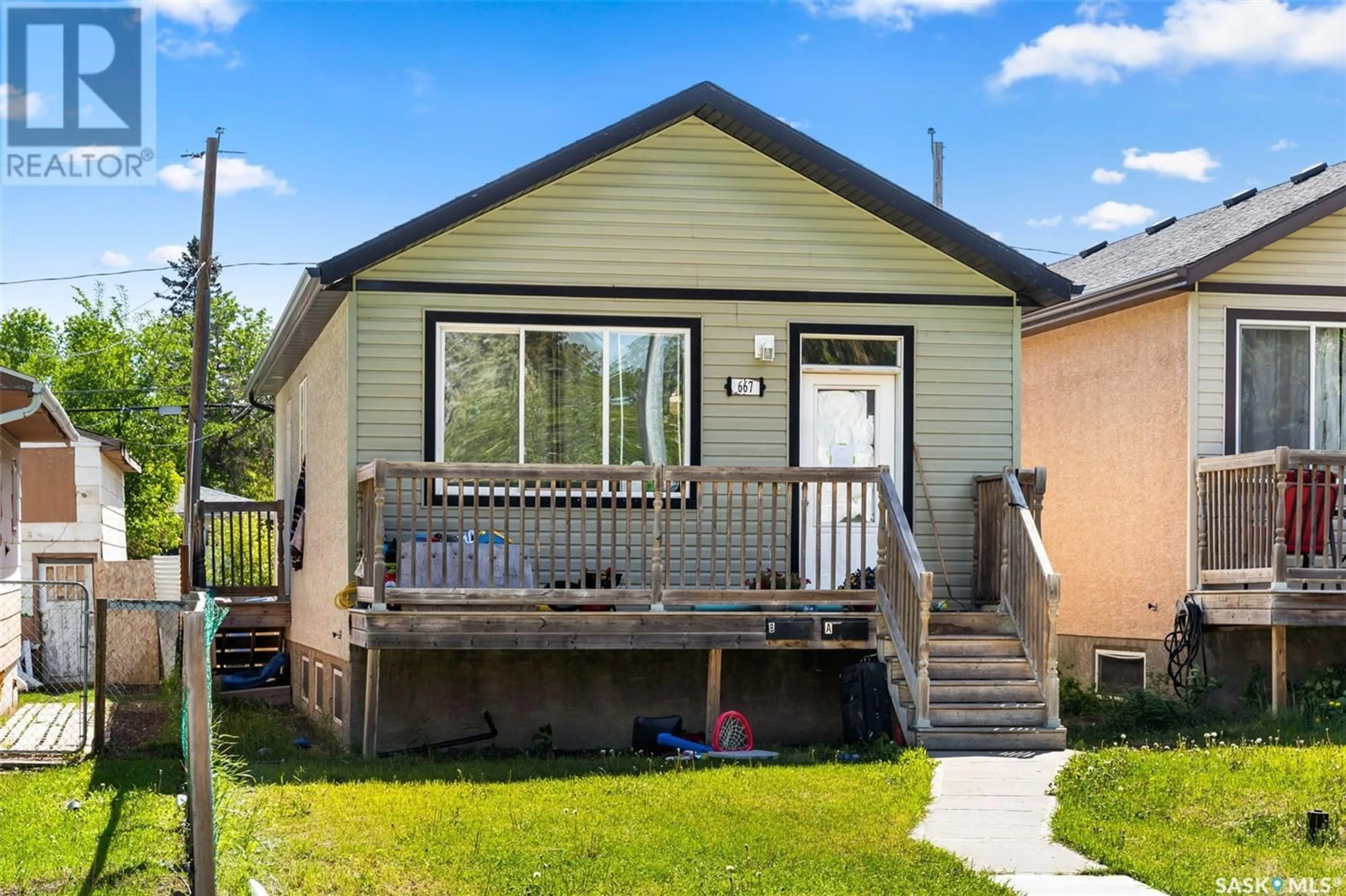 Home with vinyl exterior material, street for 667 Athol STREET, Regina Saskatchewan S4T3B2