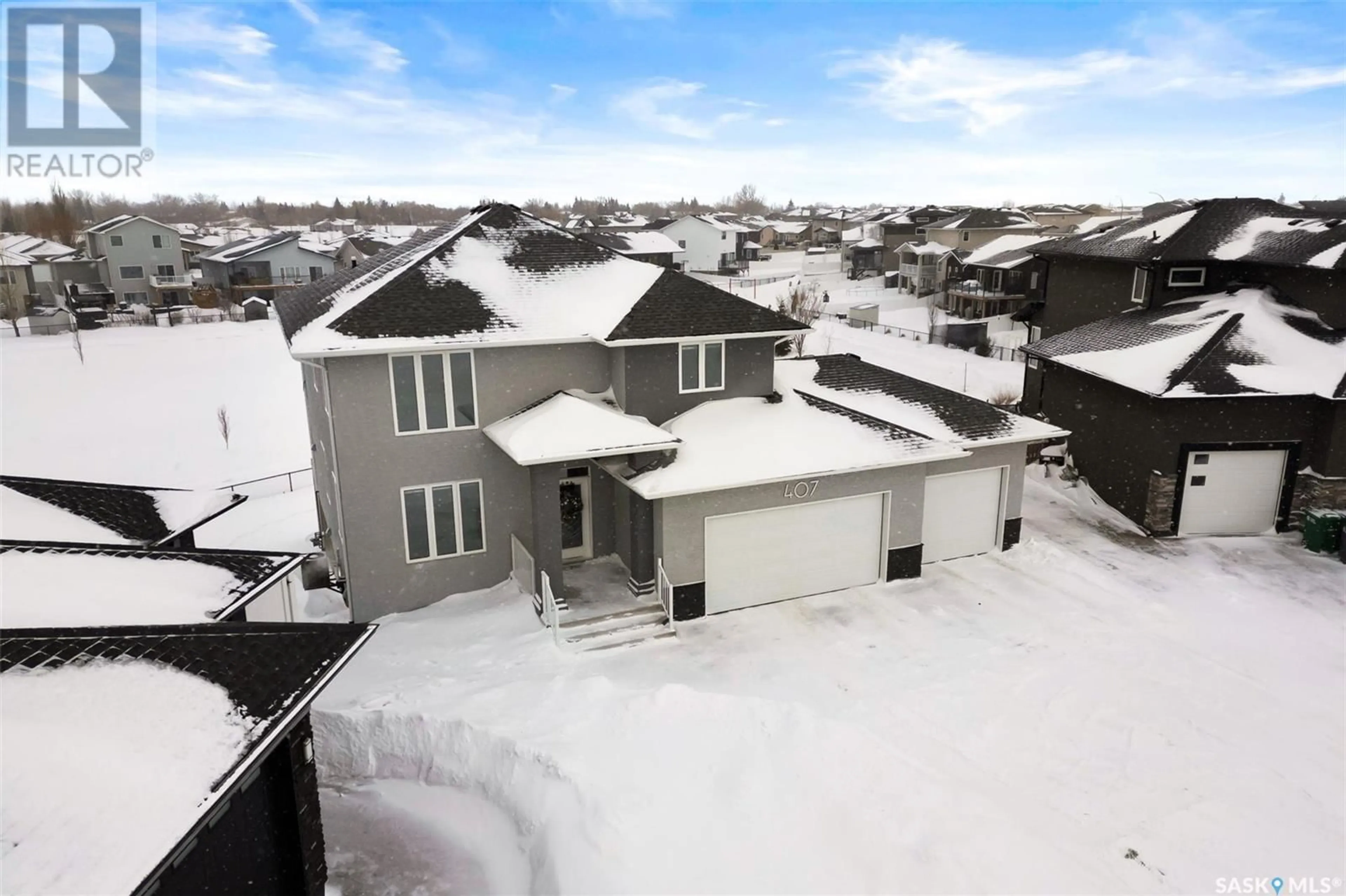 A pic from outside/outdoor area/front of a property/back of a property/a pic from drone, street for 407 PLAINS COURT, Pilot Butte Saskatchewan S0G3Z0