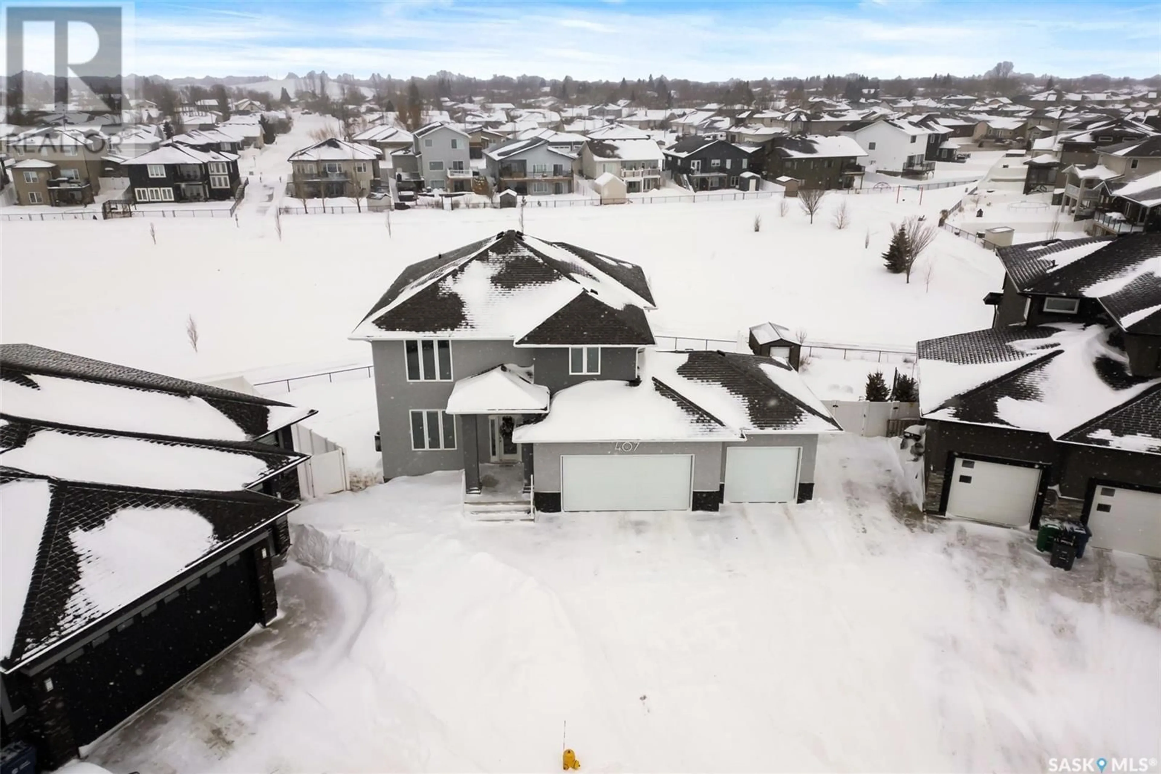 A pic from outside/outdoor area/front of a property/back of a property/a pic from drone, street for 407 PLAINS COURT, Pilot Butte Saskatchewan S0G3Z0