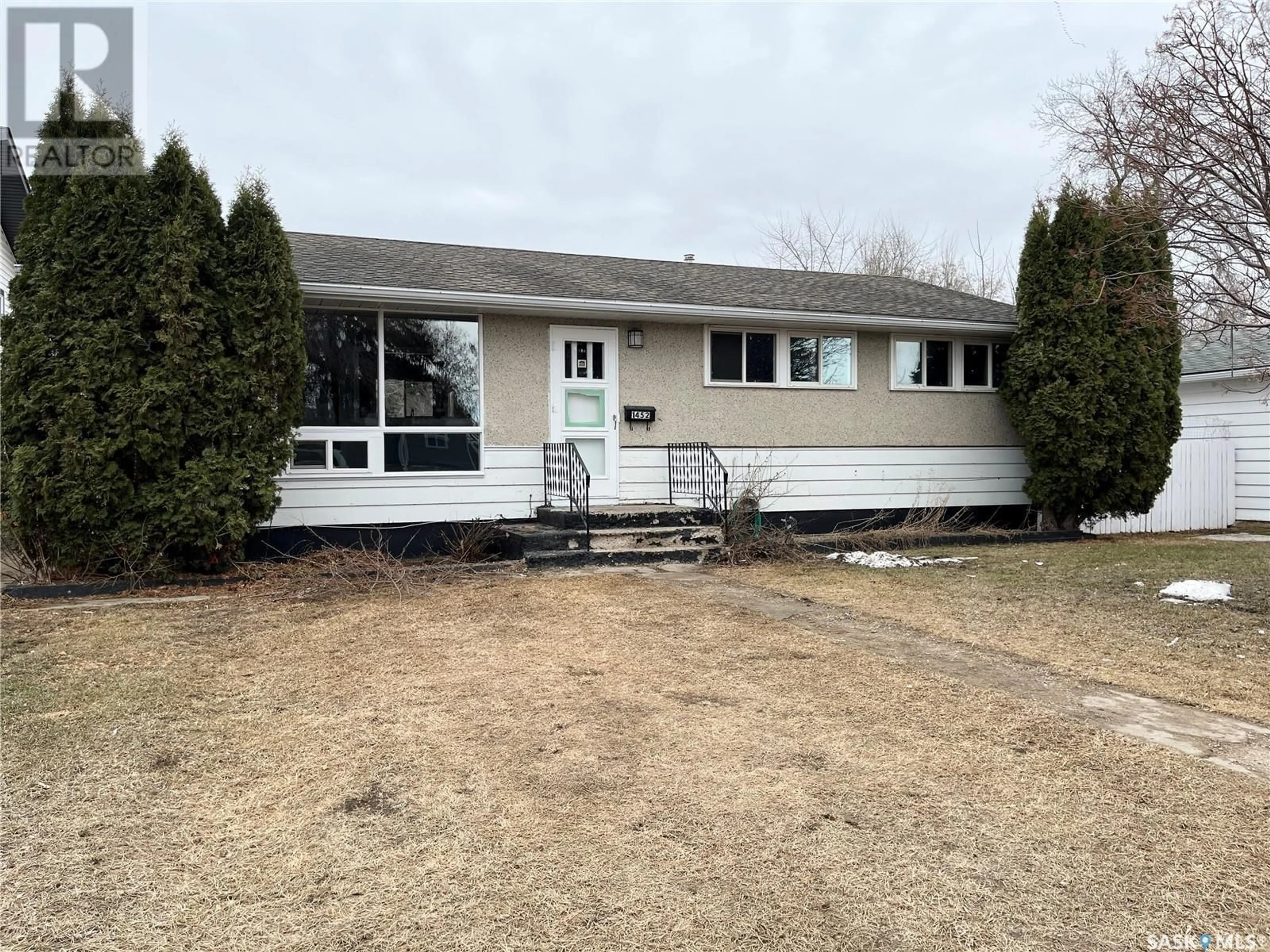 Home with vinyl exterior material, street for 1452 109th STREET, North Battleford Saskatchewan S9A2G3