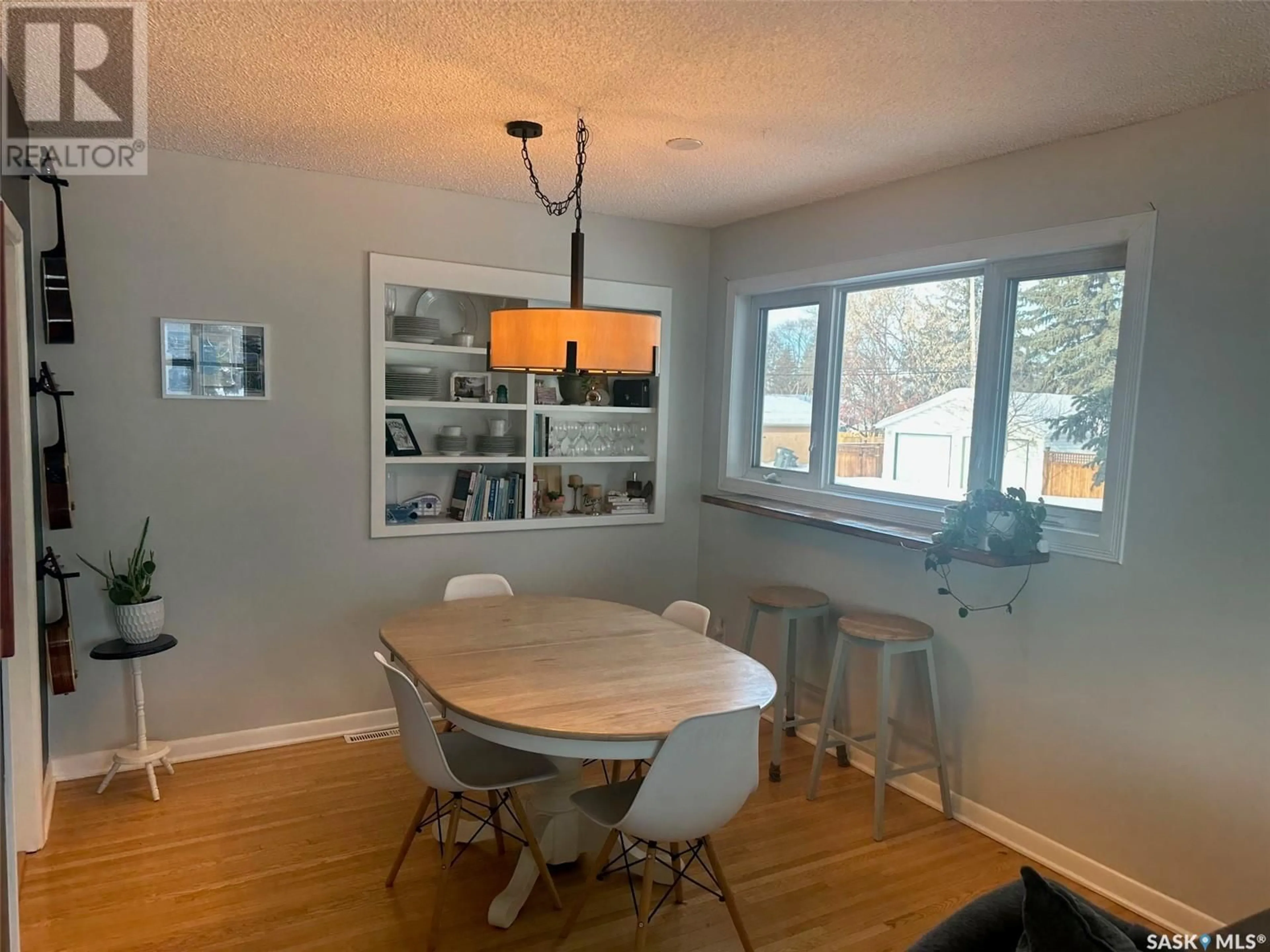 Dining room, wood/laminate floor for 2202 Clarence AVENUE S, Saskatoon Saskatchewan S7J1L7