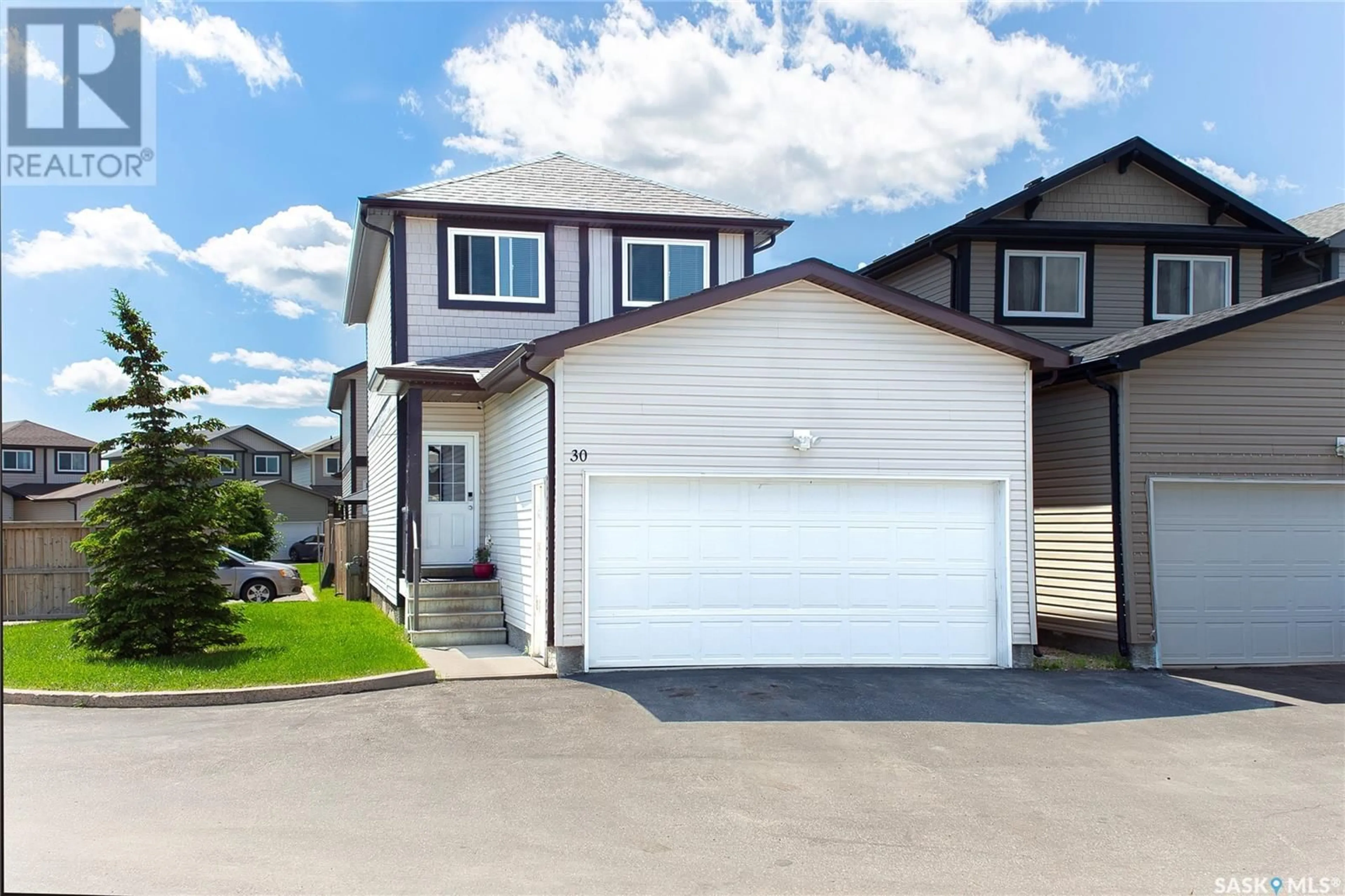 Home with vinyl exterior material, street for 30 202 McKague CRESCENT, Saskatoon Saskatchewan S7R0A6