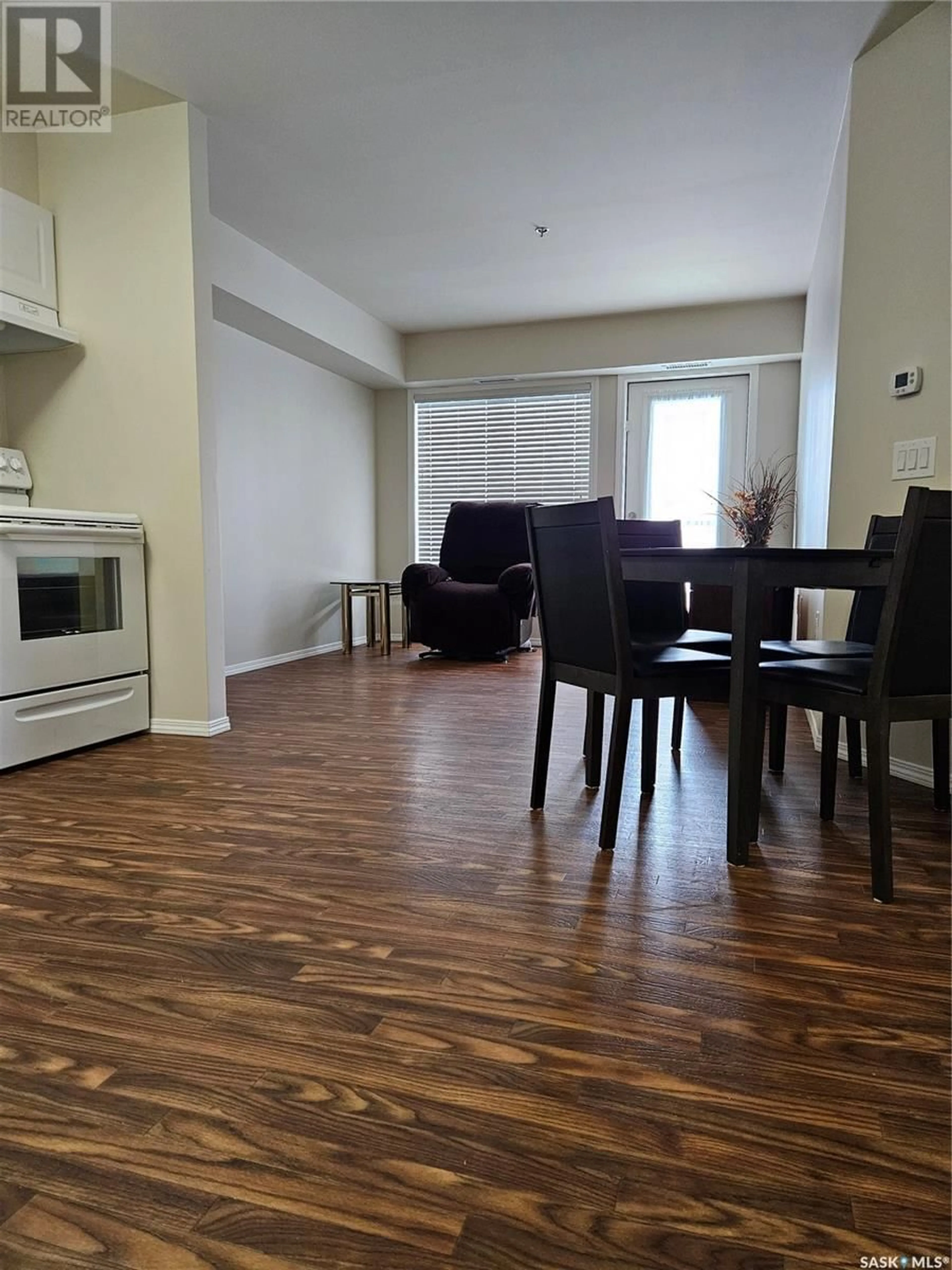 Living room with furniture, wood/laminate floor for 202 601 110th AVENUE, Tisdale Saskatchewan S0E1T0