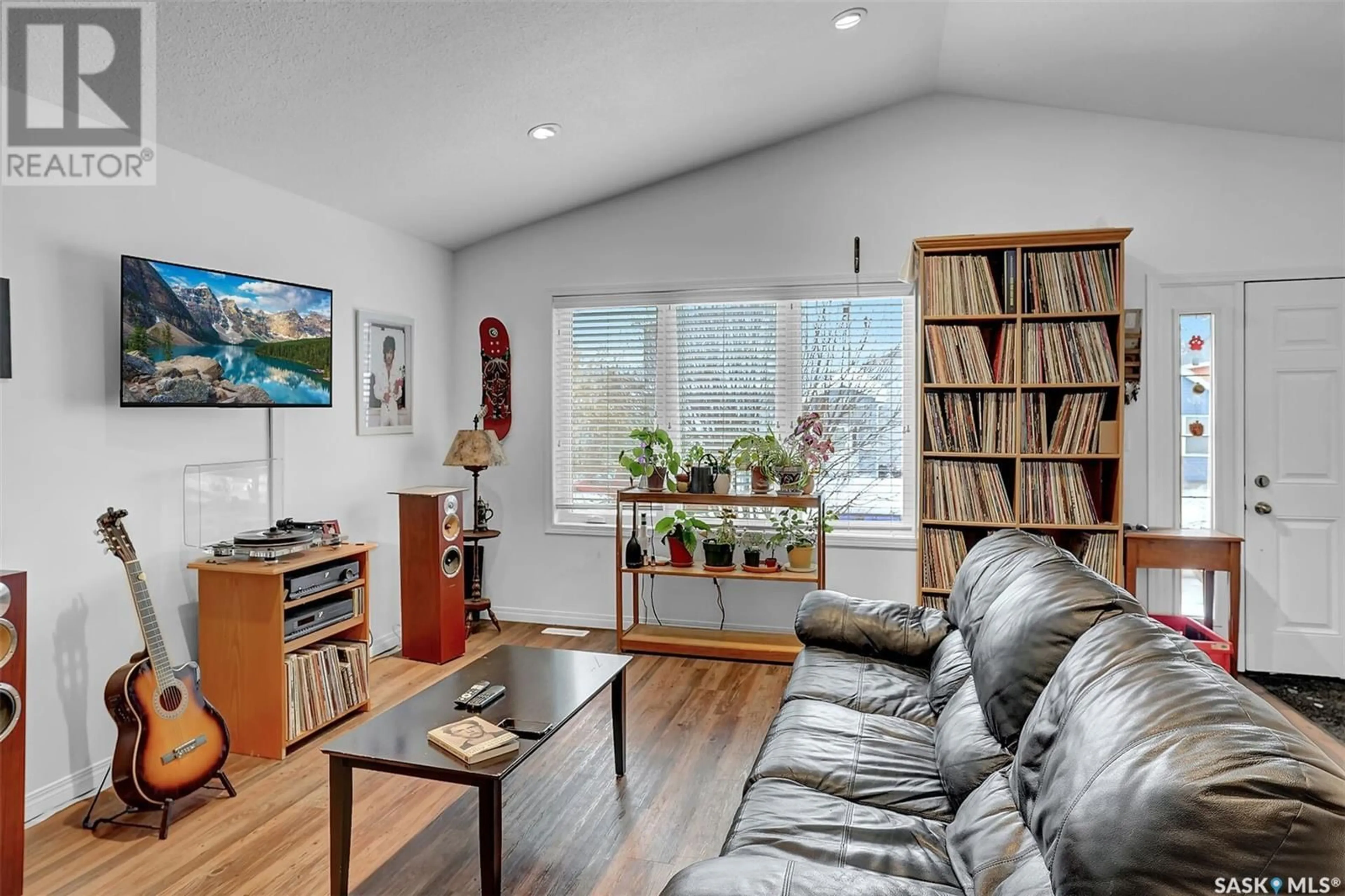 Living room with furniture, wood/laminate floor for 1937 Atkinson STREET, Regina Saskatchewan S4N3W6