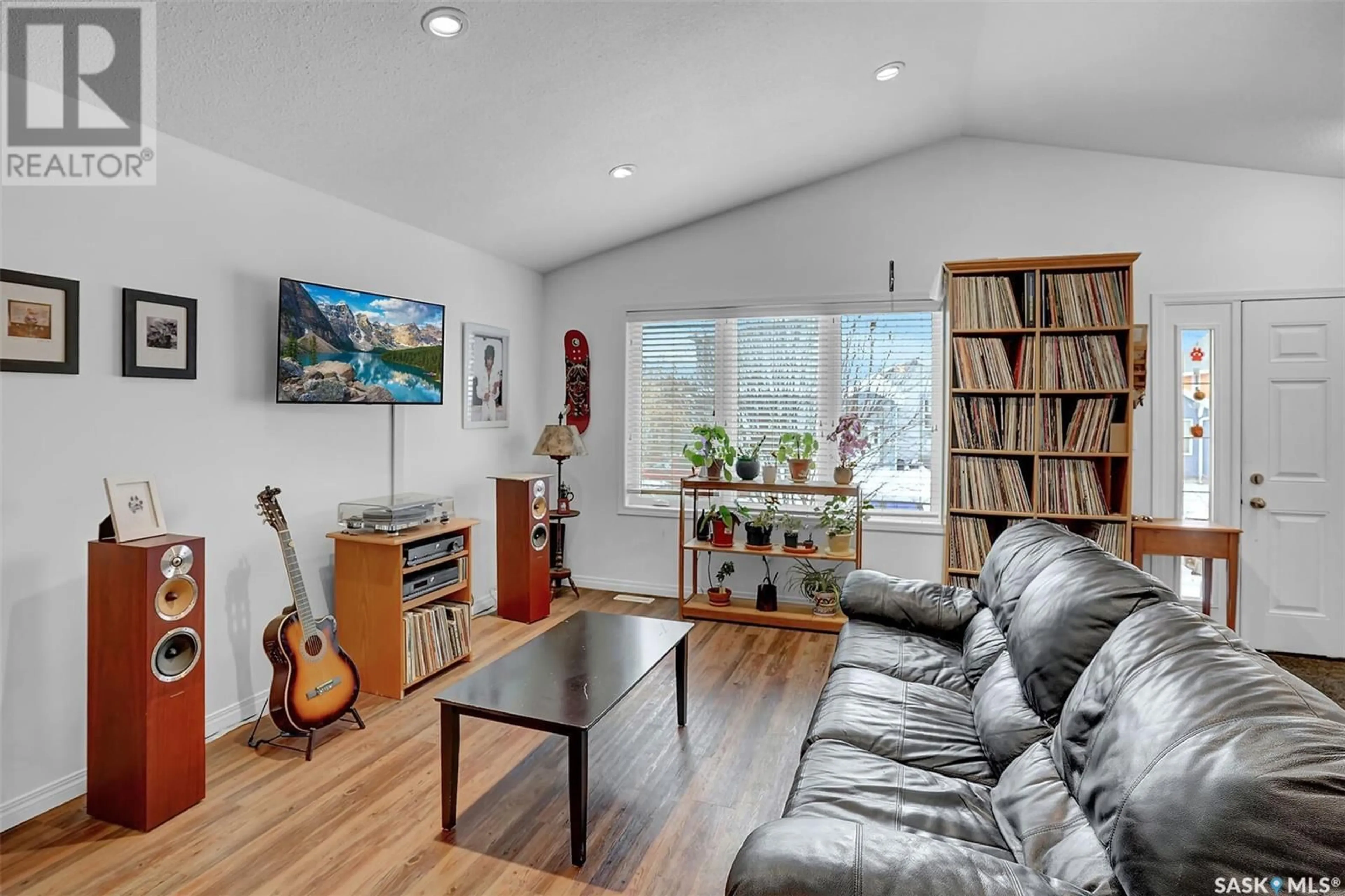 Living room with furniture, wood/laminate floor for 1937 Atkinson STREET, Regina Saskatchewan S4N3W6