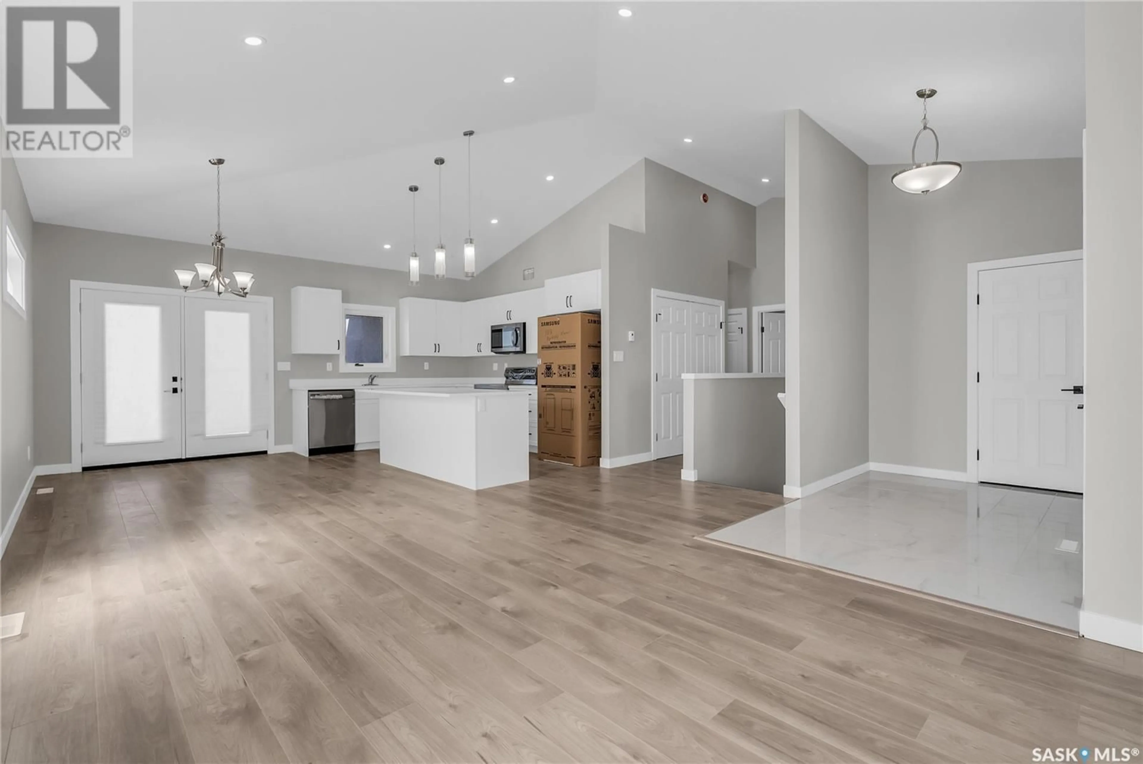 Open concept kitchen, wood/laminate floor for 570 KINLOCH COURT, Saskatoon Saskatchewan S7M5X2