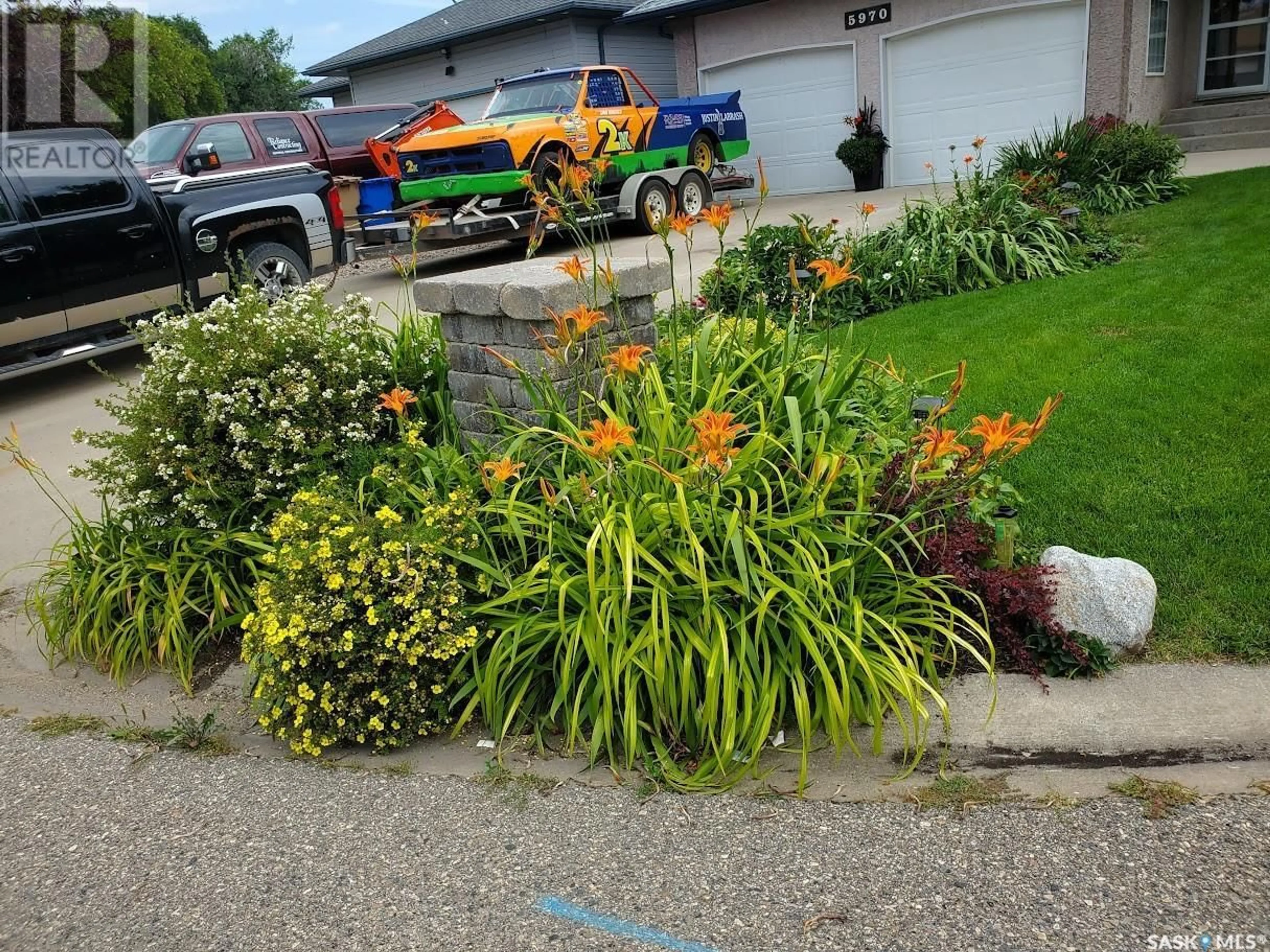 A pic from outside/outdoor area/front of a property/back of a property/a pic from drone, street for 5970 Mallard WAY, Regina Saskatchewan S4T7X6