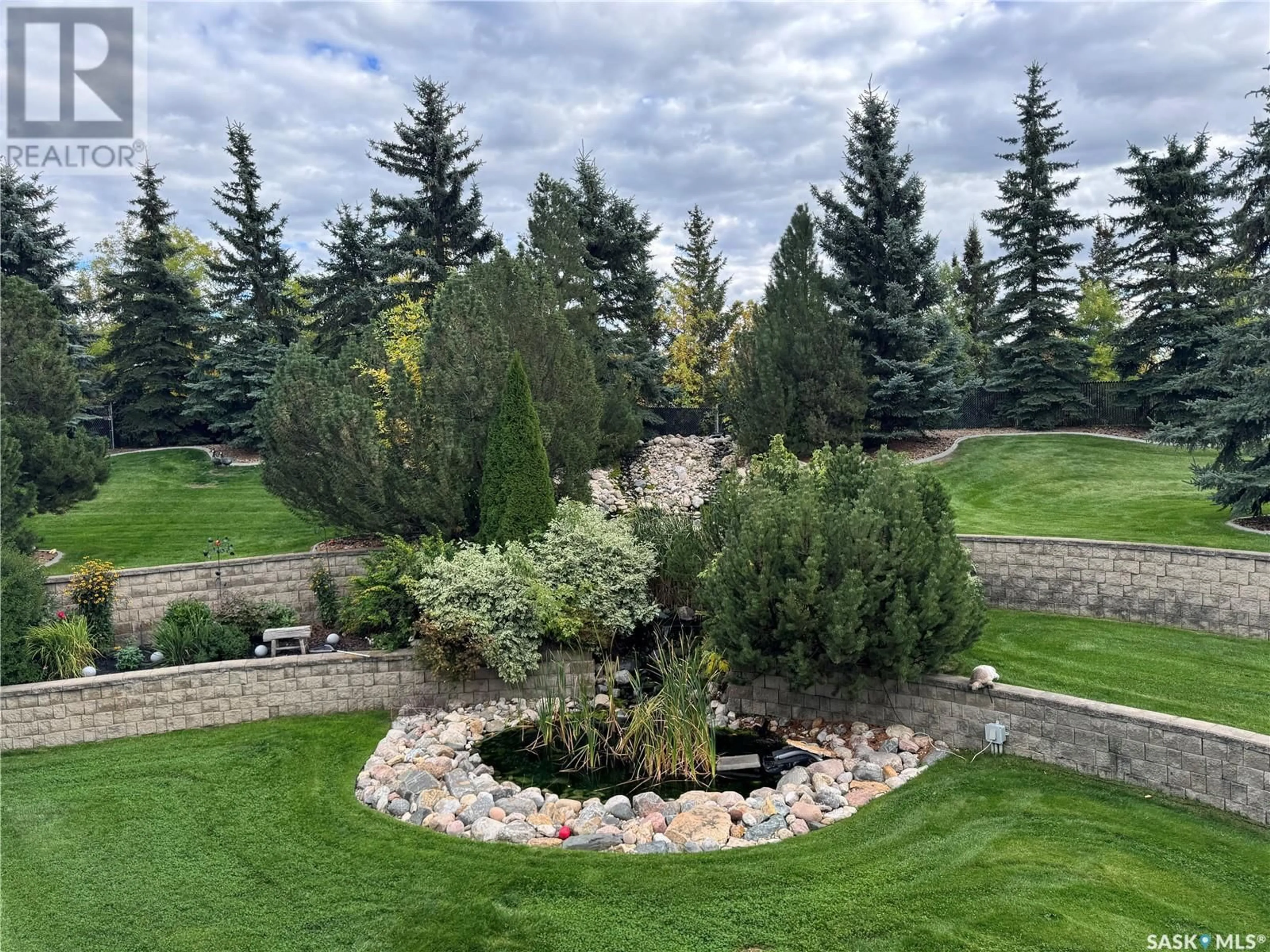 A pic from outside/outdoor area/front of a property/back of a property/a pic from drone, water/lake/river/ocean view for 33 Redwood DRIVE, Corman Park Rm No. 344 Saskatchewan S7K3J6