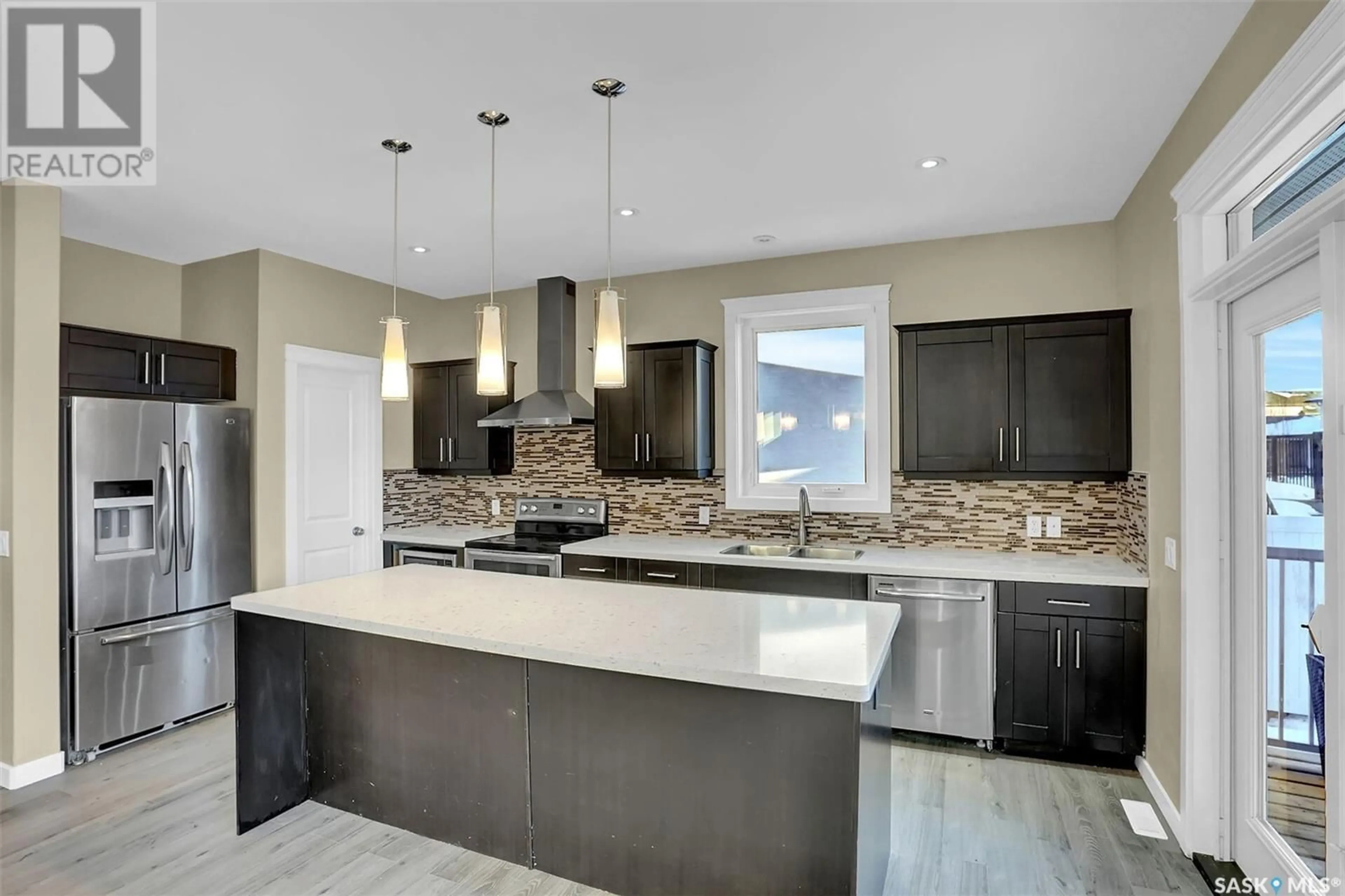 Open concept kitchen, ceramic/tile floor for 5109 Tutor WAY, Regina Saskatchewan S4W0H4