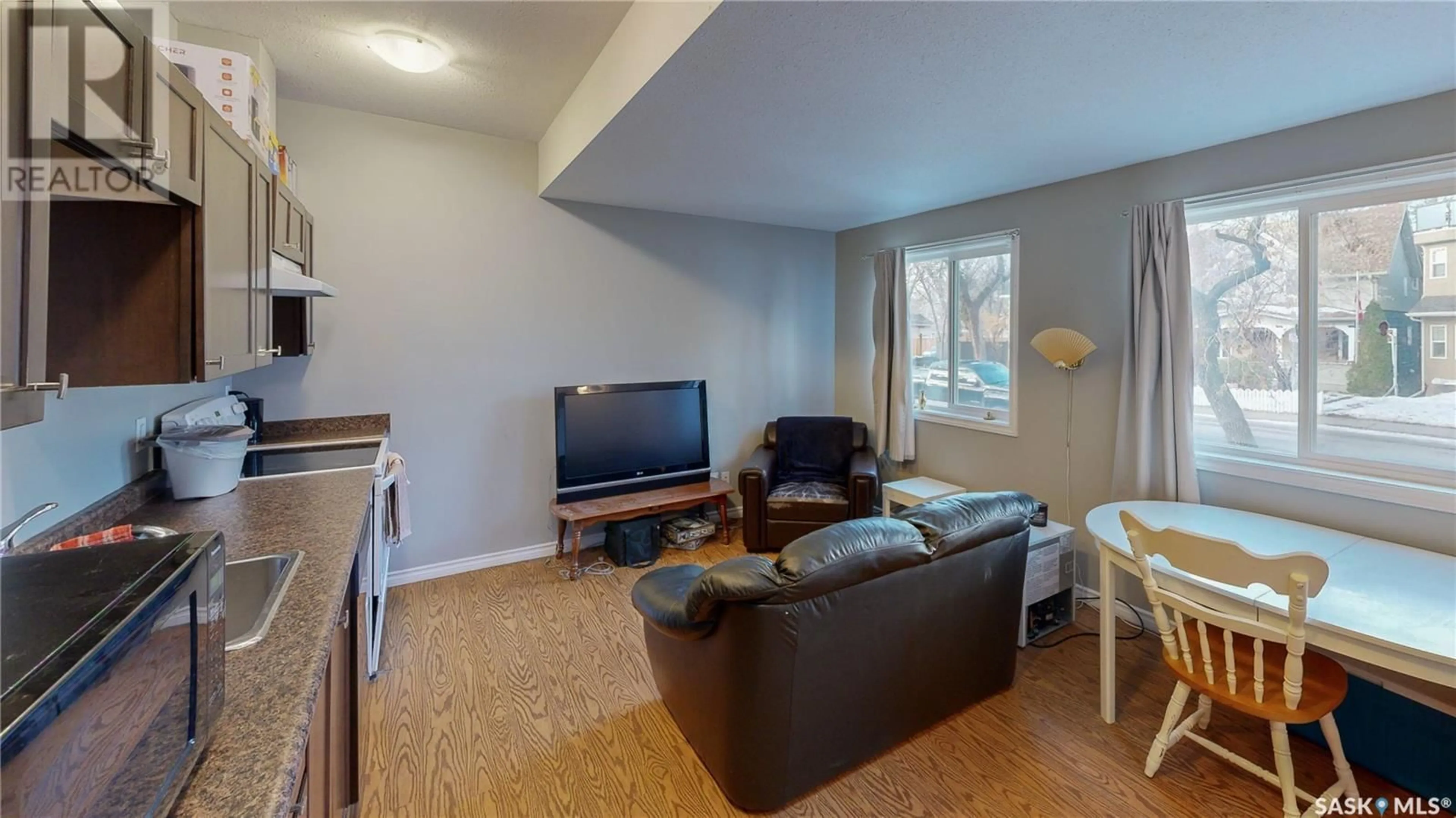 Living room with furniture, wood/laminate floor for A and B 2267 Cameron STREET, Regina Saskatchewan S4T2V9