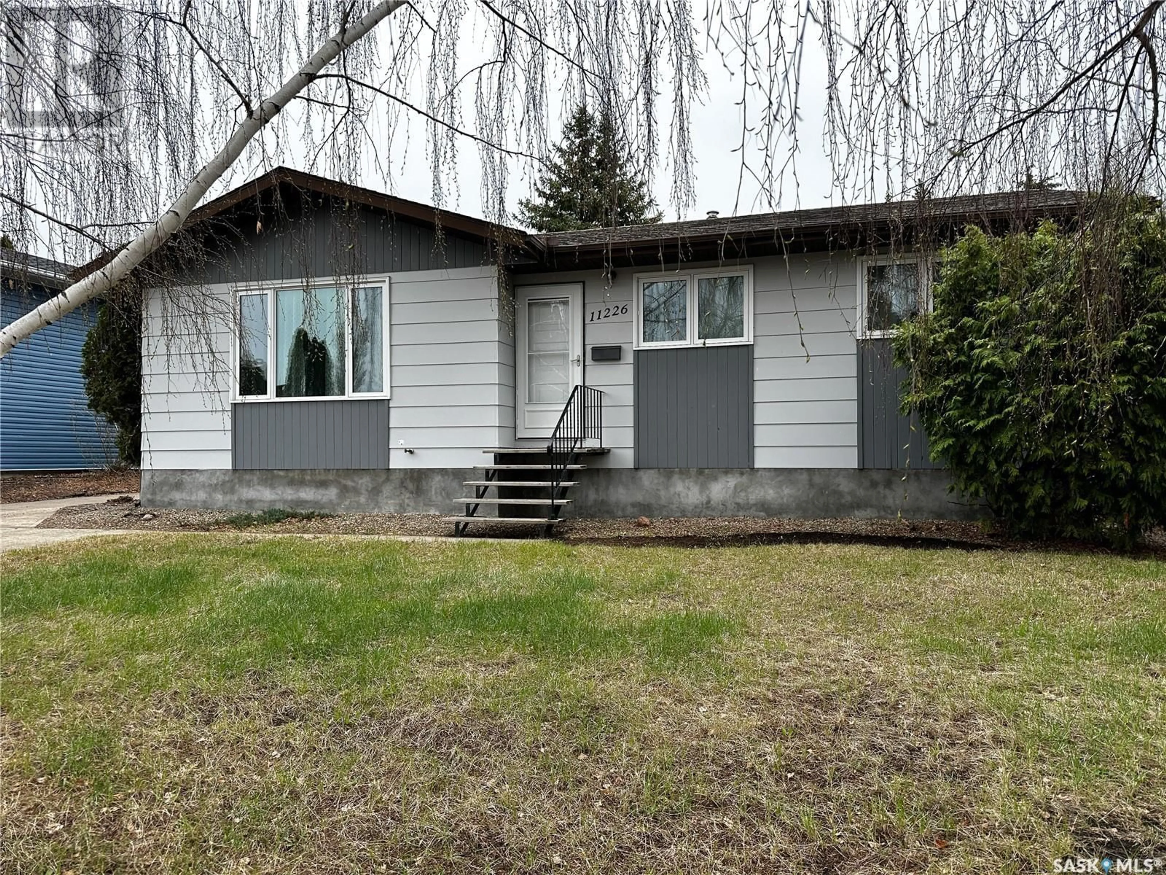 Home with vinyl exterior material, street for 11226 Gardiner DRIVE, North Battleford Saskatchewan S9A3M6