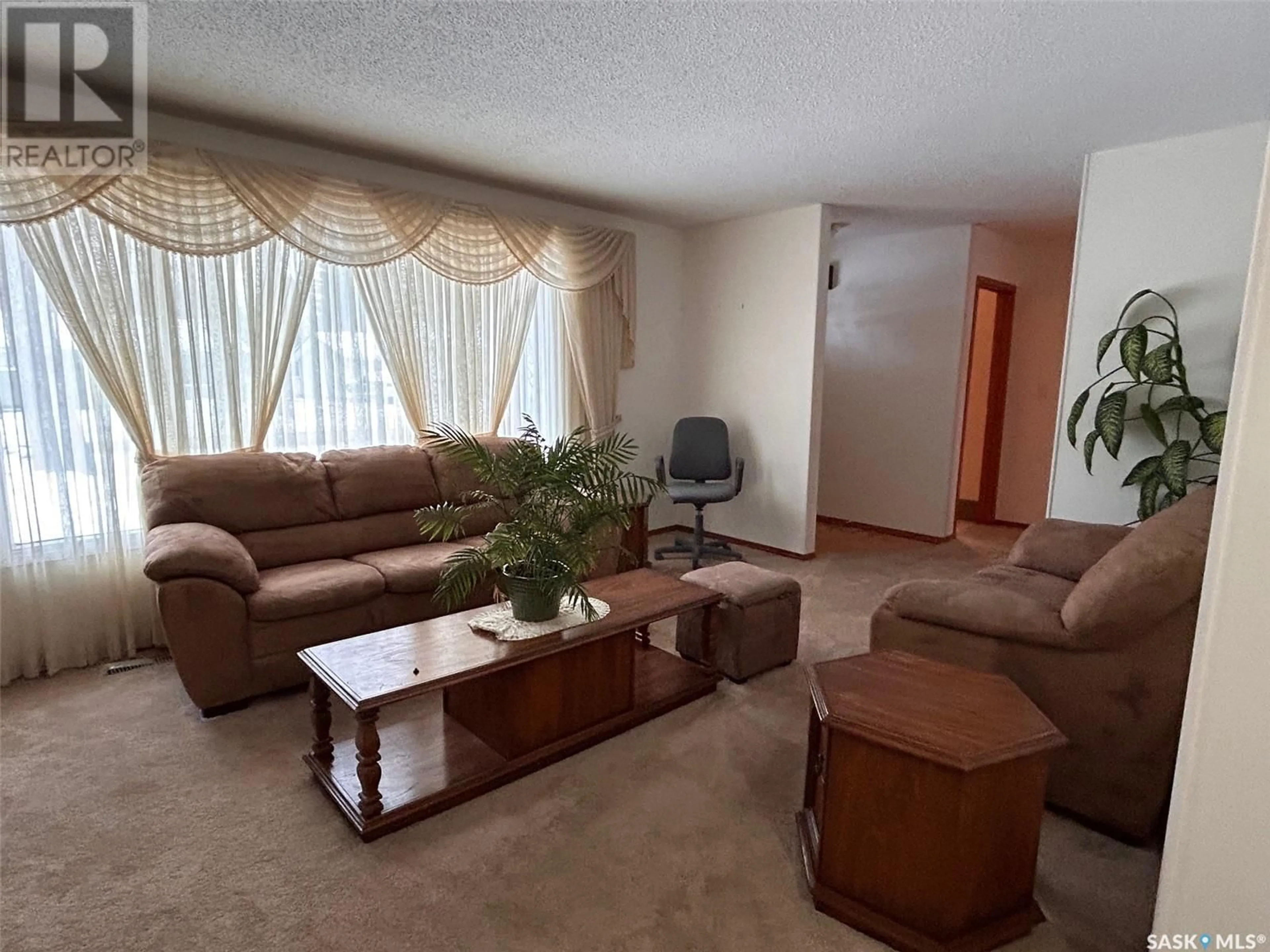 Living room with furniture, unknown for 1941 95th STREET, North Battleford Saskatchewan S9A3C6