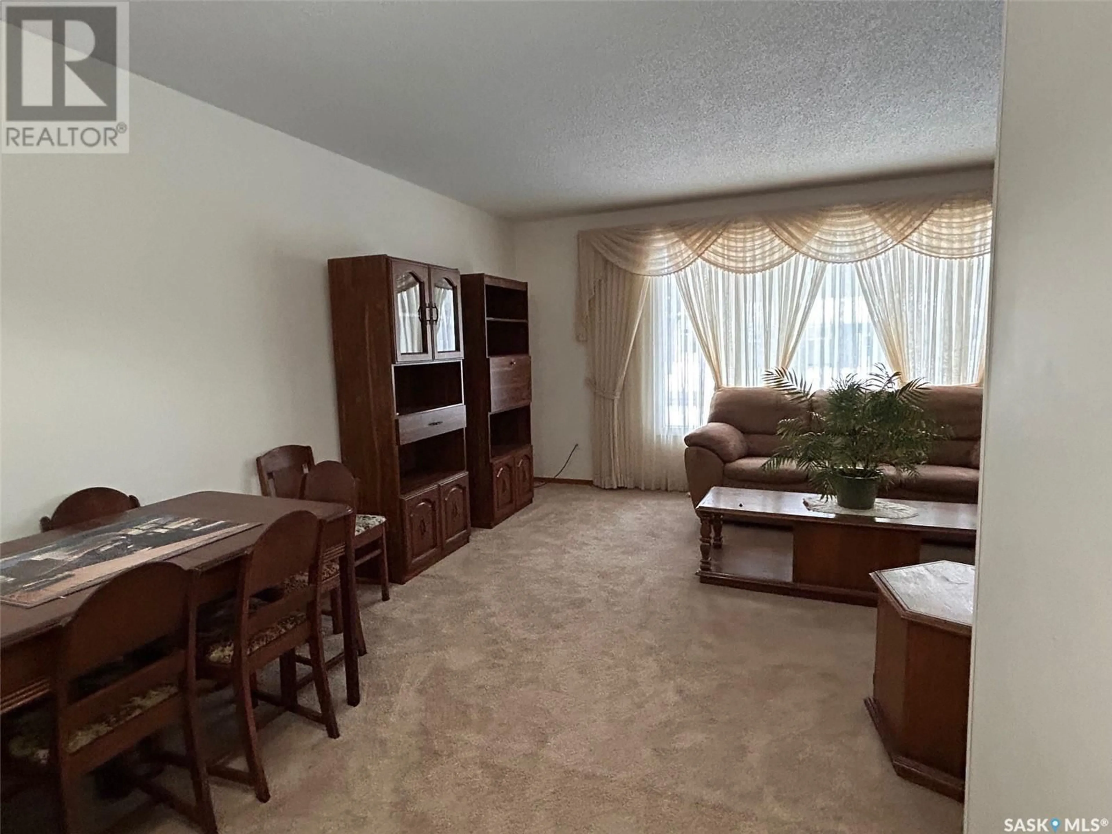 Living room with furniture, unknown for 1941 95th STREET, North Battleford Saskatchewan S9A3C6