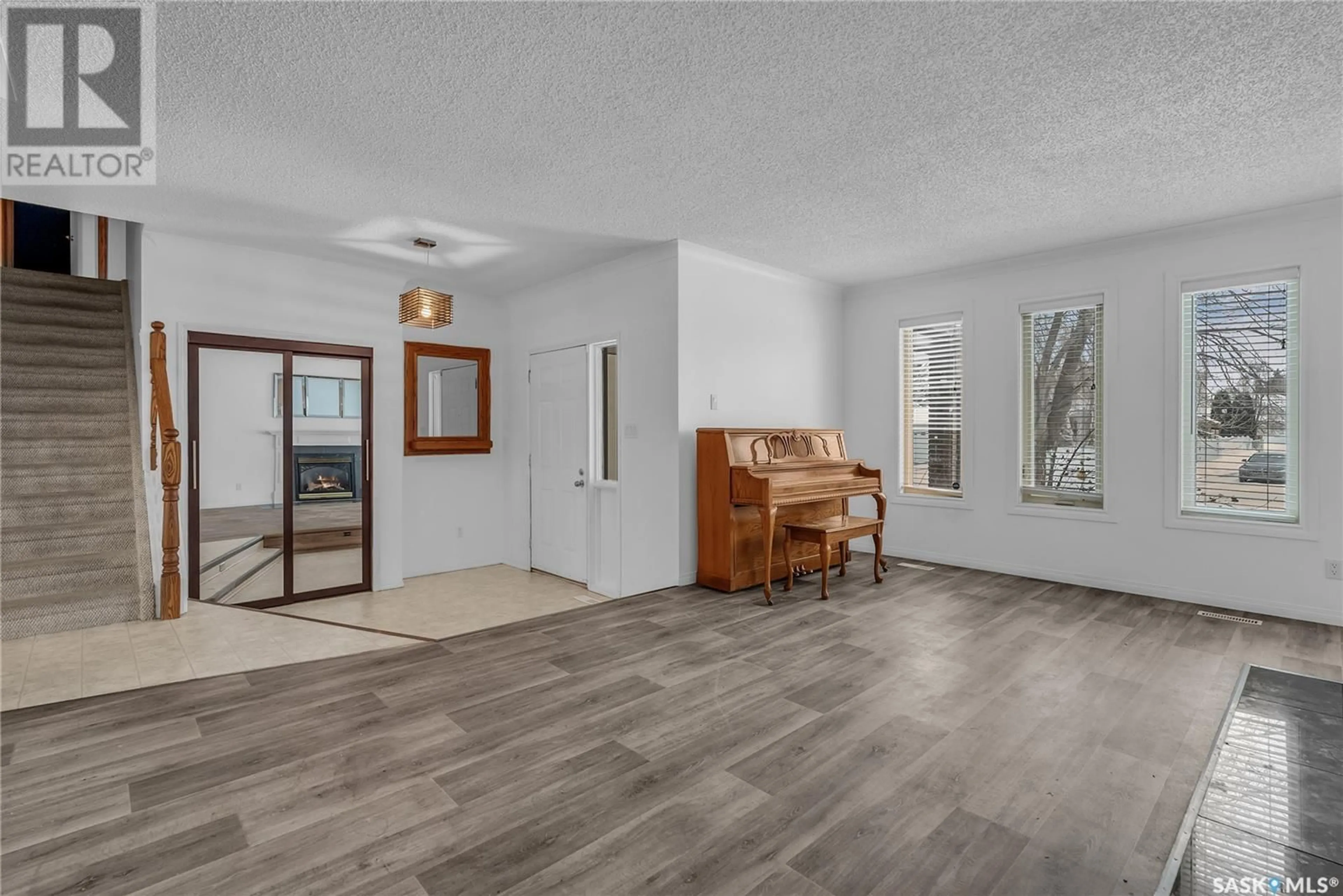 Living room with furniture, unknown for 122 Mulcaster CRESCENT, Saskatoon Saskatchewan S7N4A7