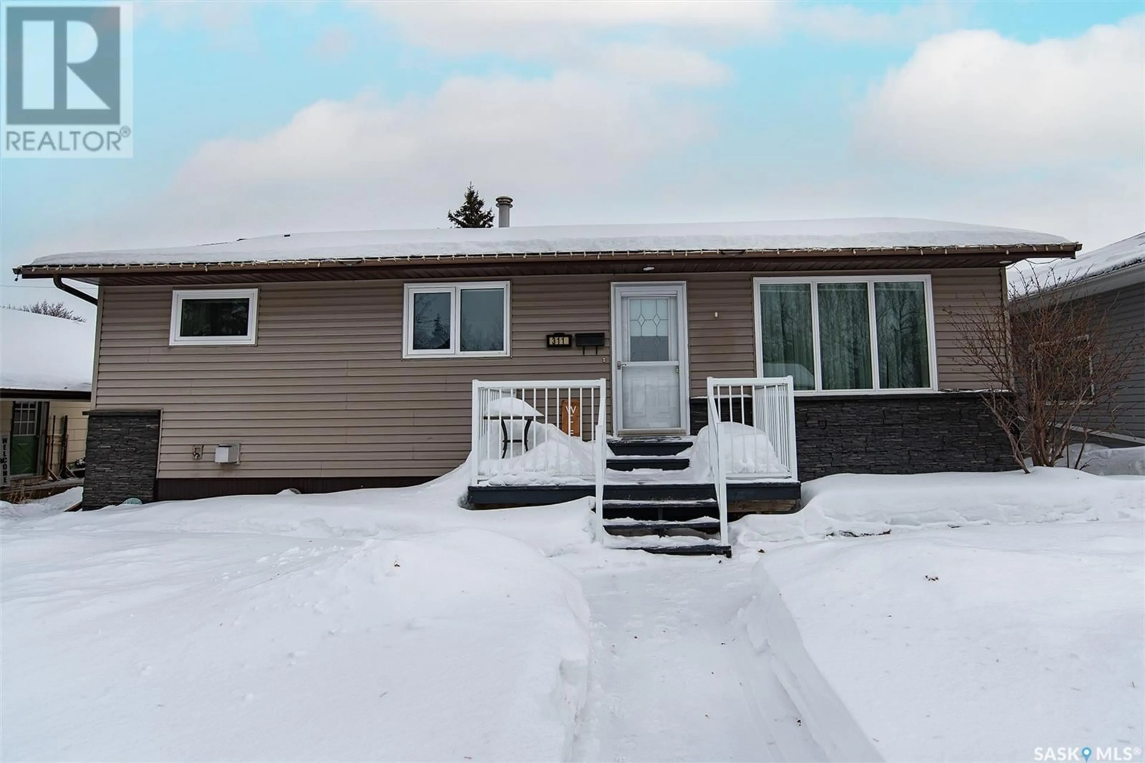 Home with vinyl exterior material, street for 311 5th STREET W, Wynyard Saskatchewan S0A4T0