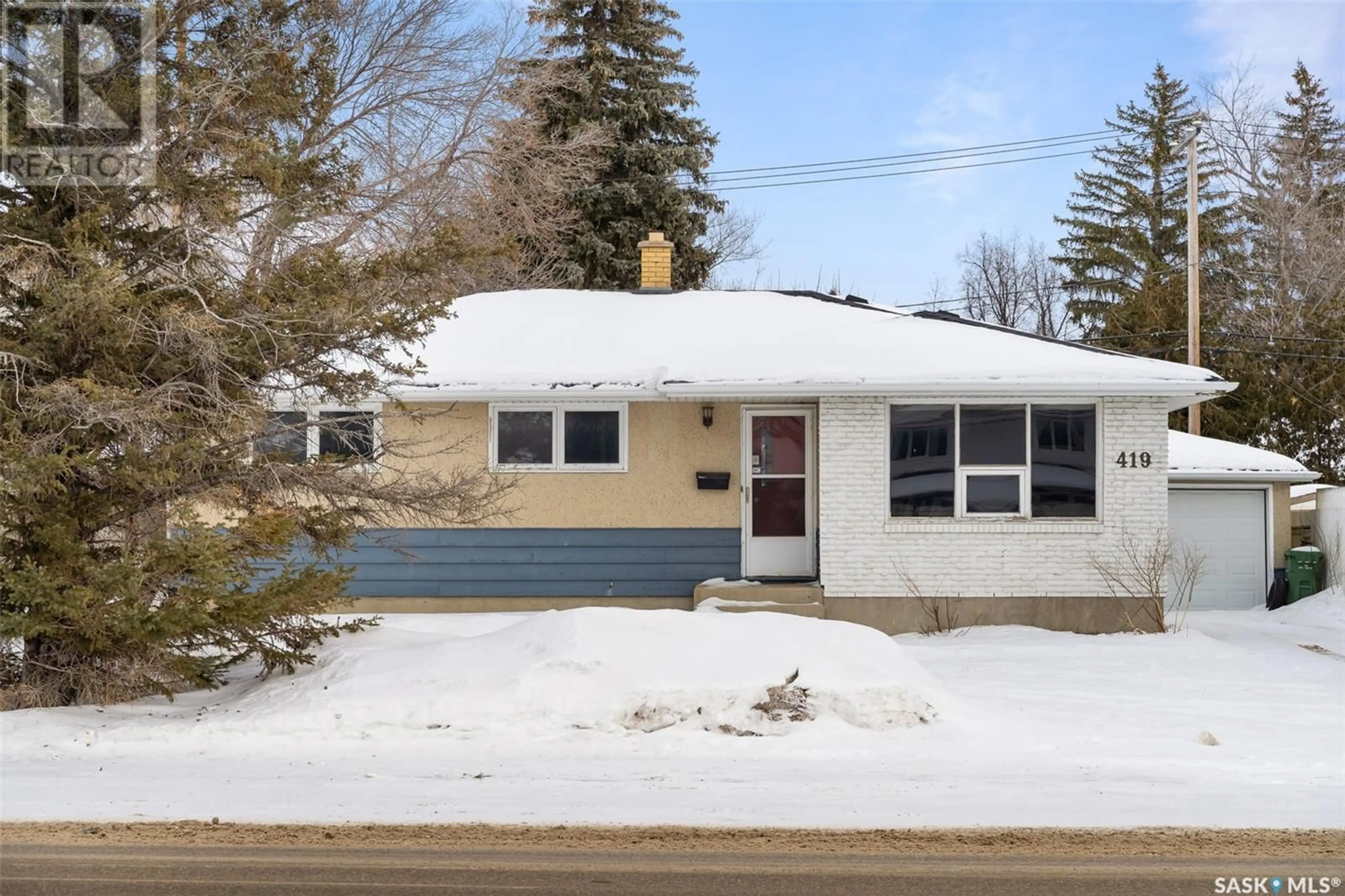 Home with vinyl exterior material, street for 419 McIntosh STREET N, Regina Saskatchewan S4R5A3