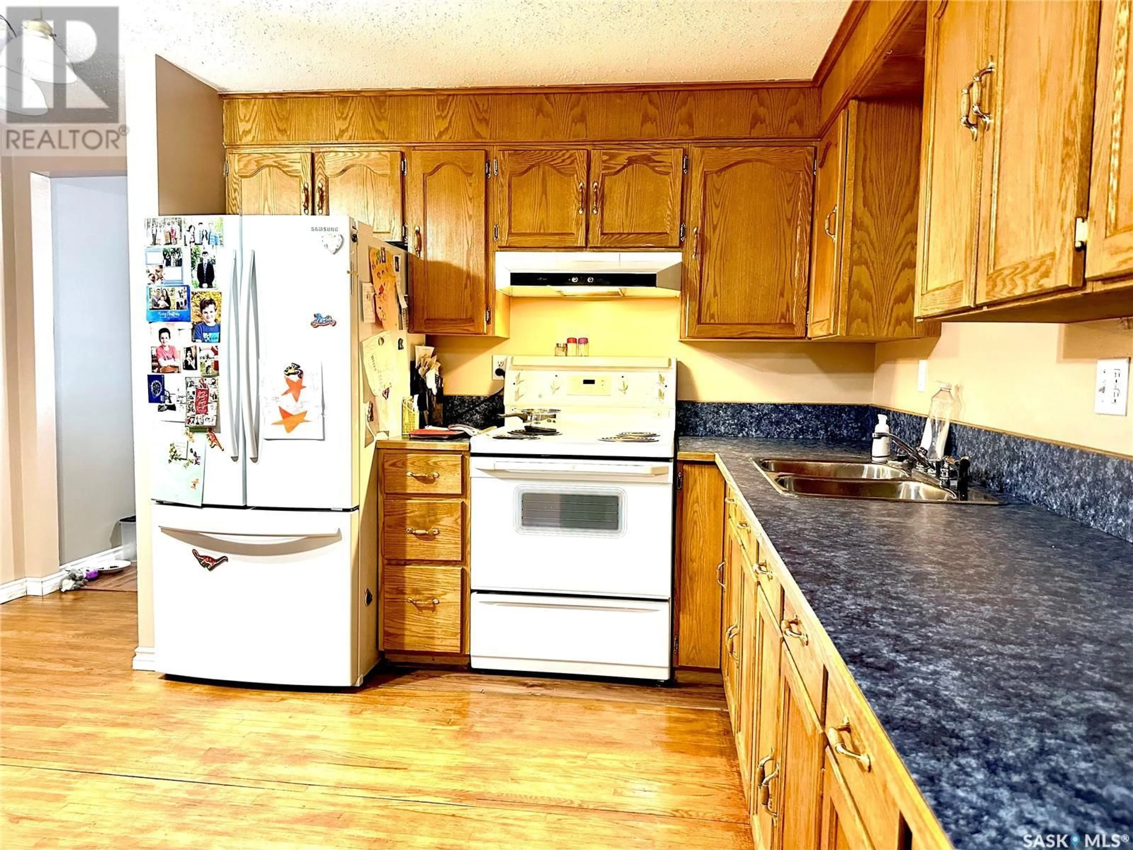 Standard kitchen, wood/laminate floor for 30 1st STREET W, Birch Hills Saskatchewan S0J0G0