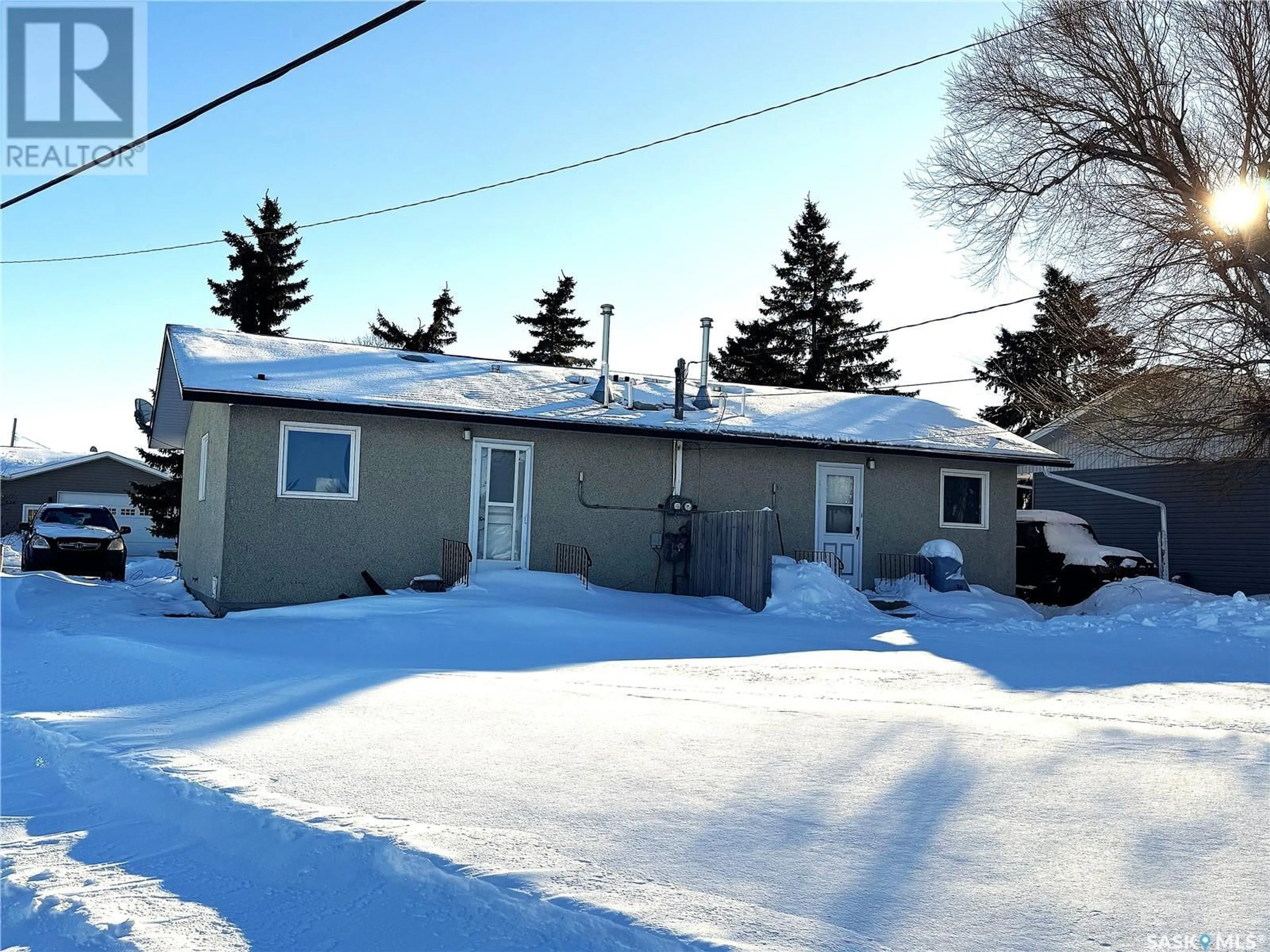 A pic from outside/outdoor area/front of a property/back of a property/a pic from drone, street for 221 & 223 4th STREET NE, Watson Saskatchewan S0K4V0