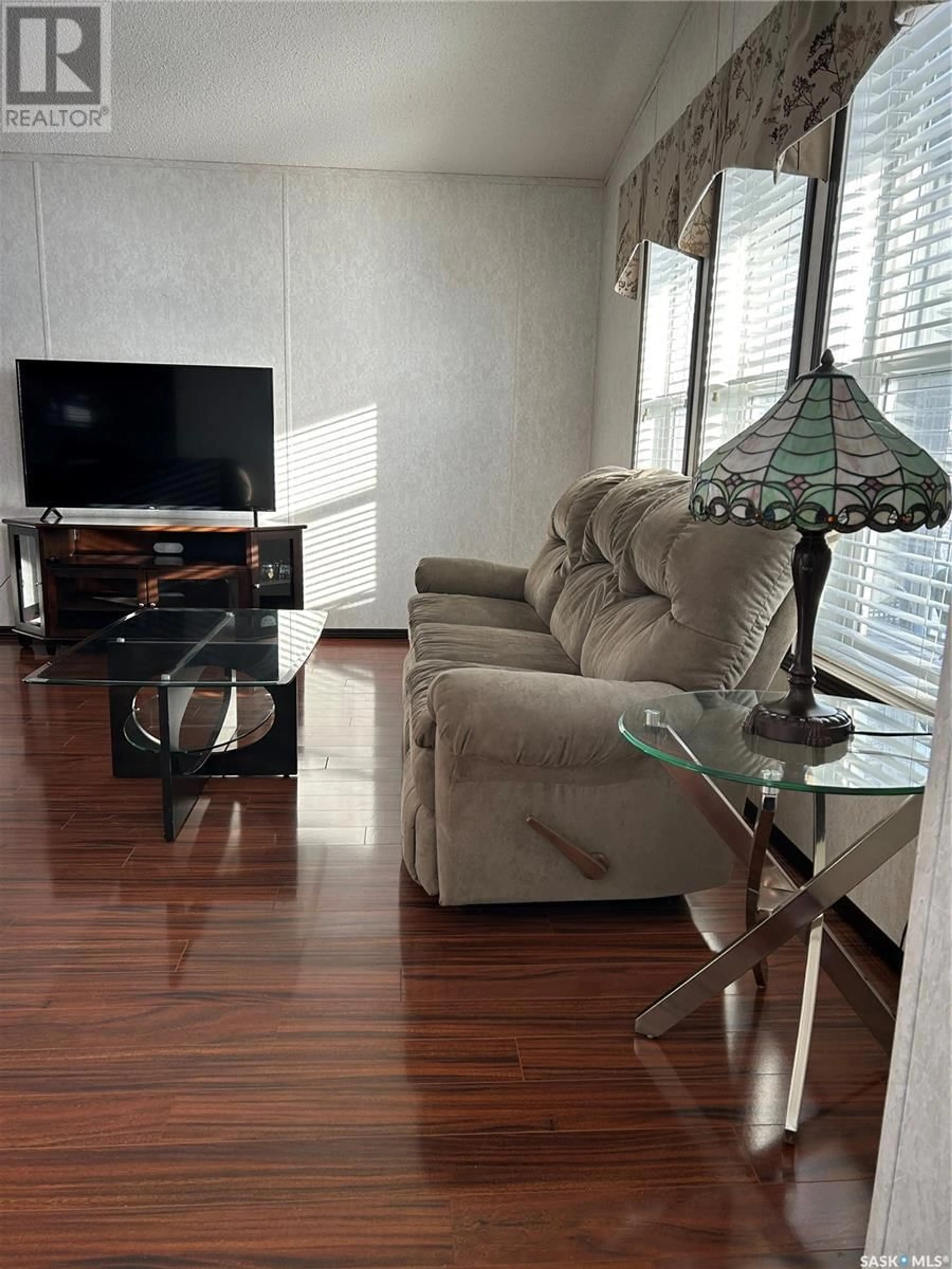 Living room with furniture, wood/laminate floor for 199 Shurygalo ROAD, Bienfait Saskatchewan S0C0M0