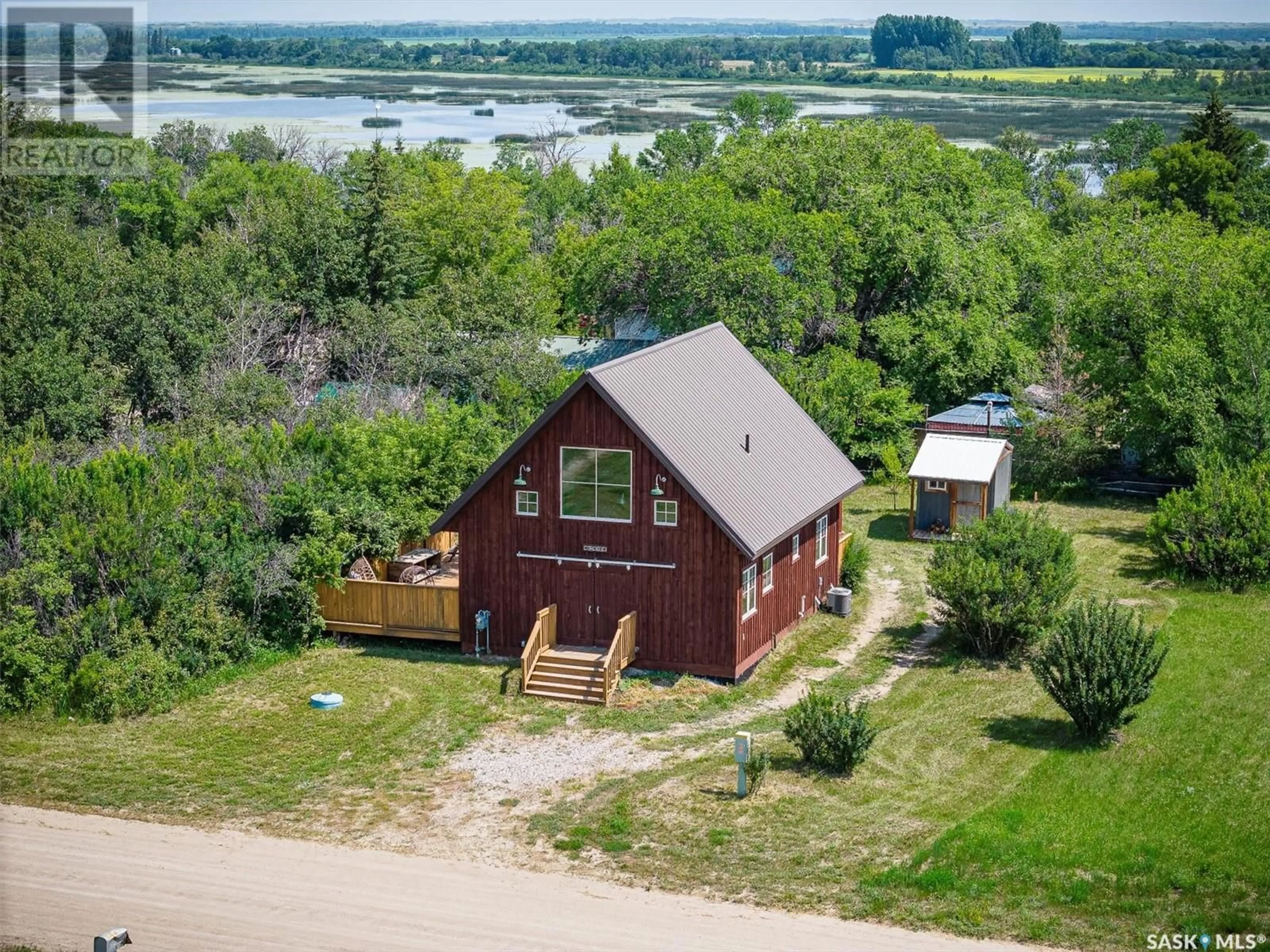 A pic from outside/outdoor area/front of a property/back of a property/a pic from drone, water/lake/river/ocean view for 7 Snake Trail ROAD, Pike Lake Saskatchewan S7K1N2