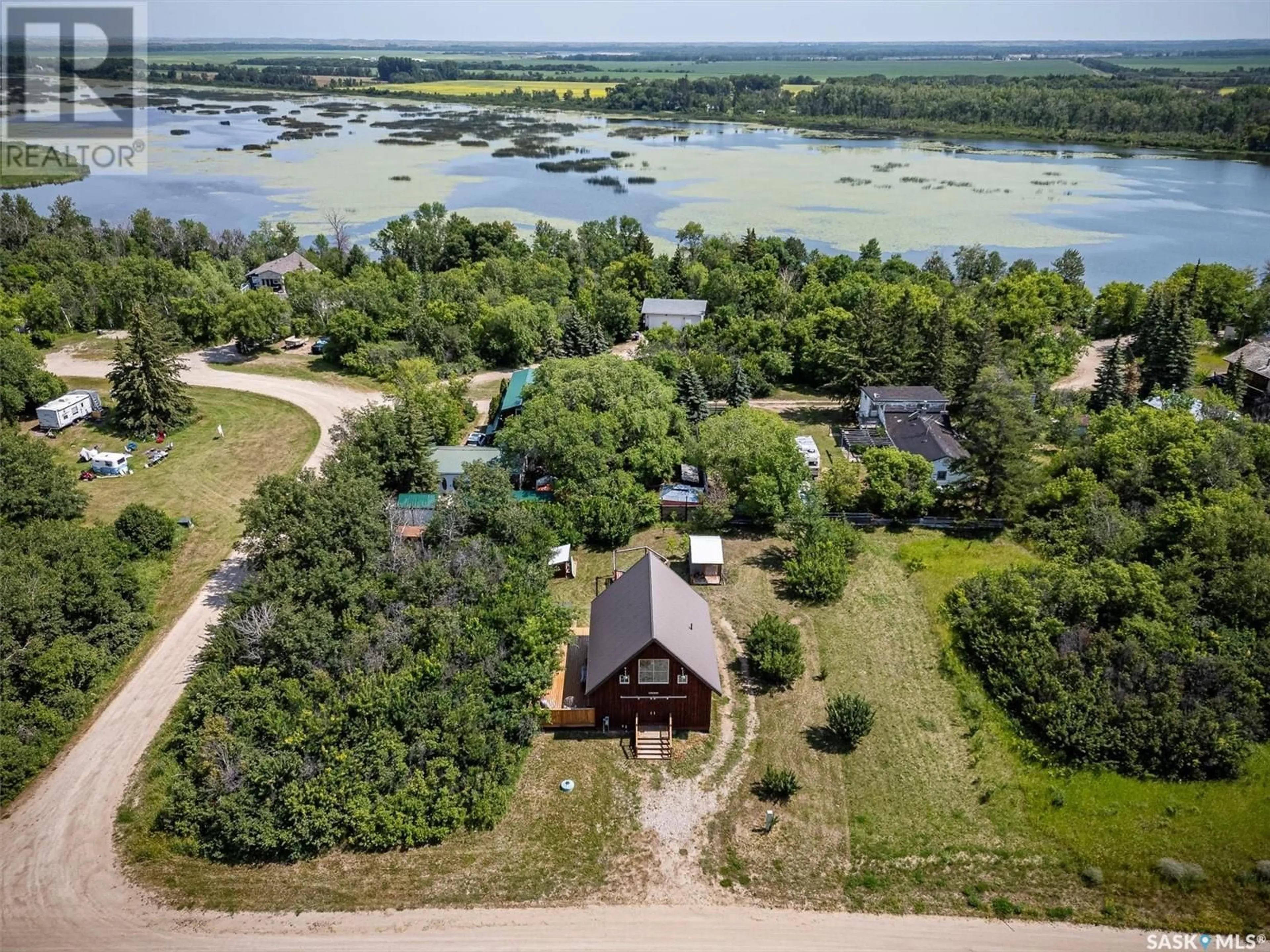 A pic from outside/outdoor area/front of a property/back of a property/a pic from drone, water/lake/river/ocean view for 7 Snake Trail ROAD, Pike Lake Saskatchewan S7K1N2