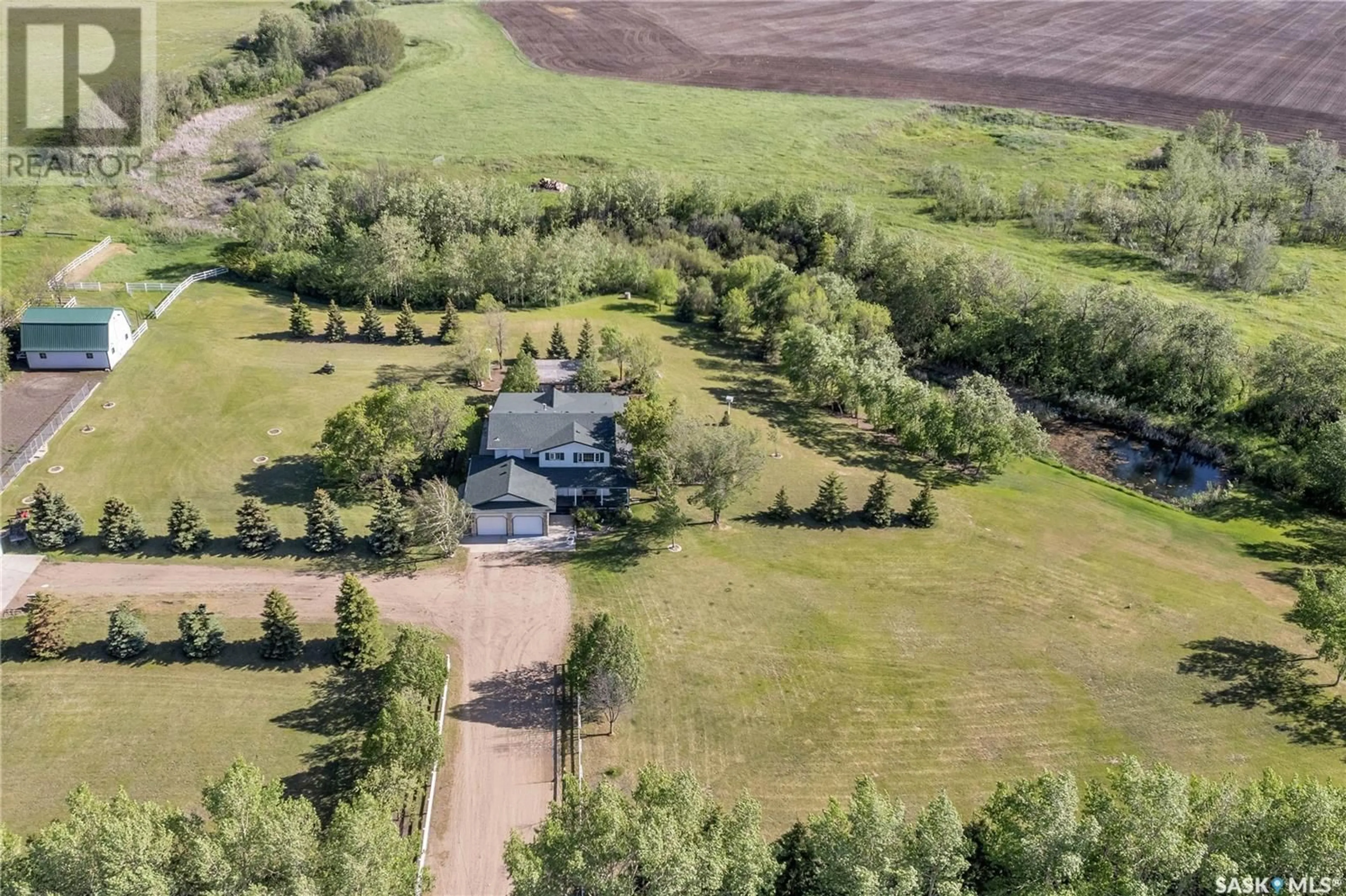 A pic from outside/outdoor area/front of a property/back of a property/a pic from drone, unknown for Pomedli Acreage, Corman Park Rm No. 344 Saskatchewan S7K3J9