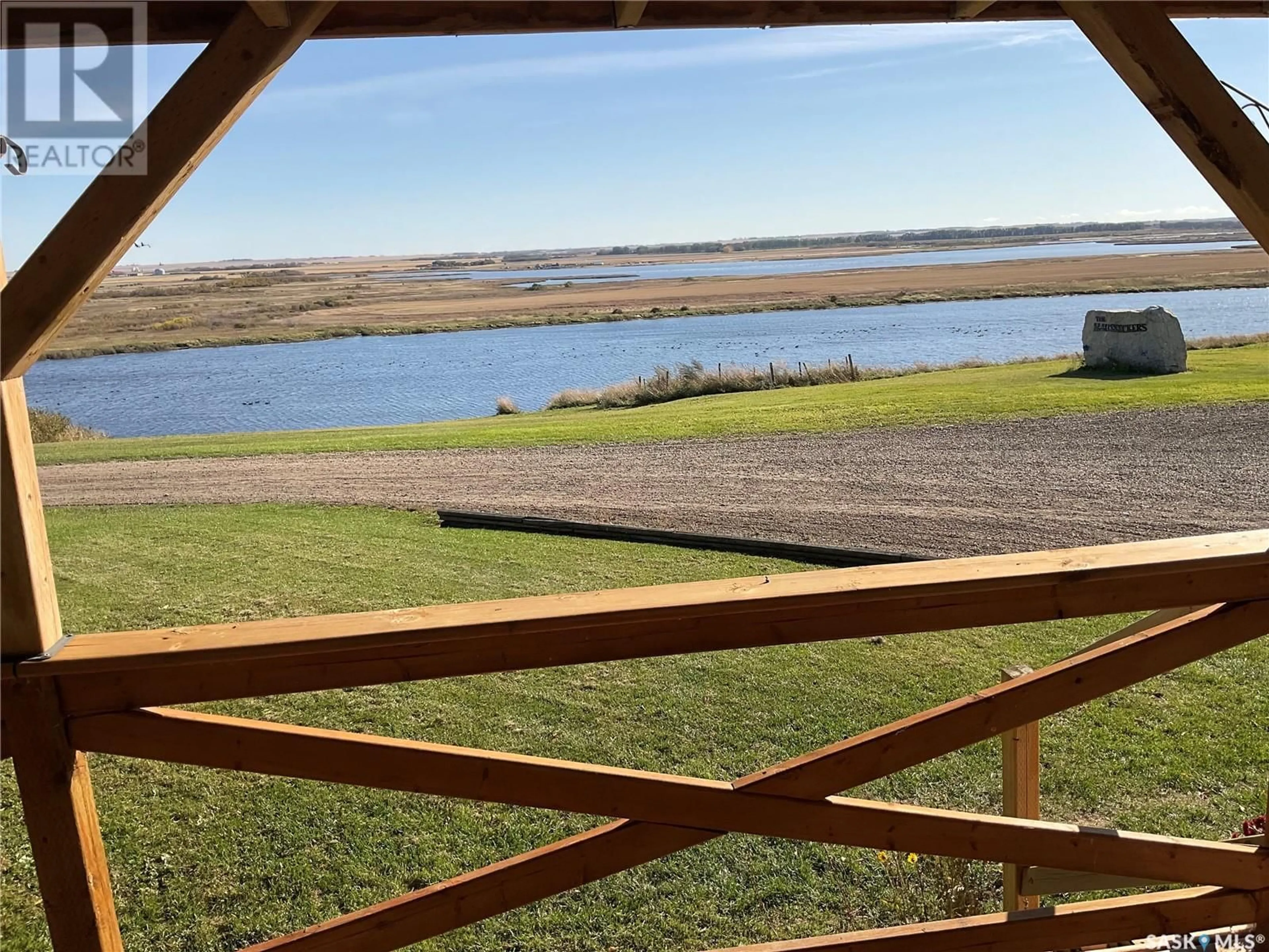 A pic from outside/outdoor area/front of a property/back of a property/a pic from drone, water/lake/river/ocean view for Haussecker acreage, Fish Creek Rm No. 402 Saskatchewan S0K4P0