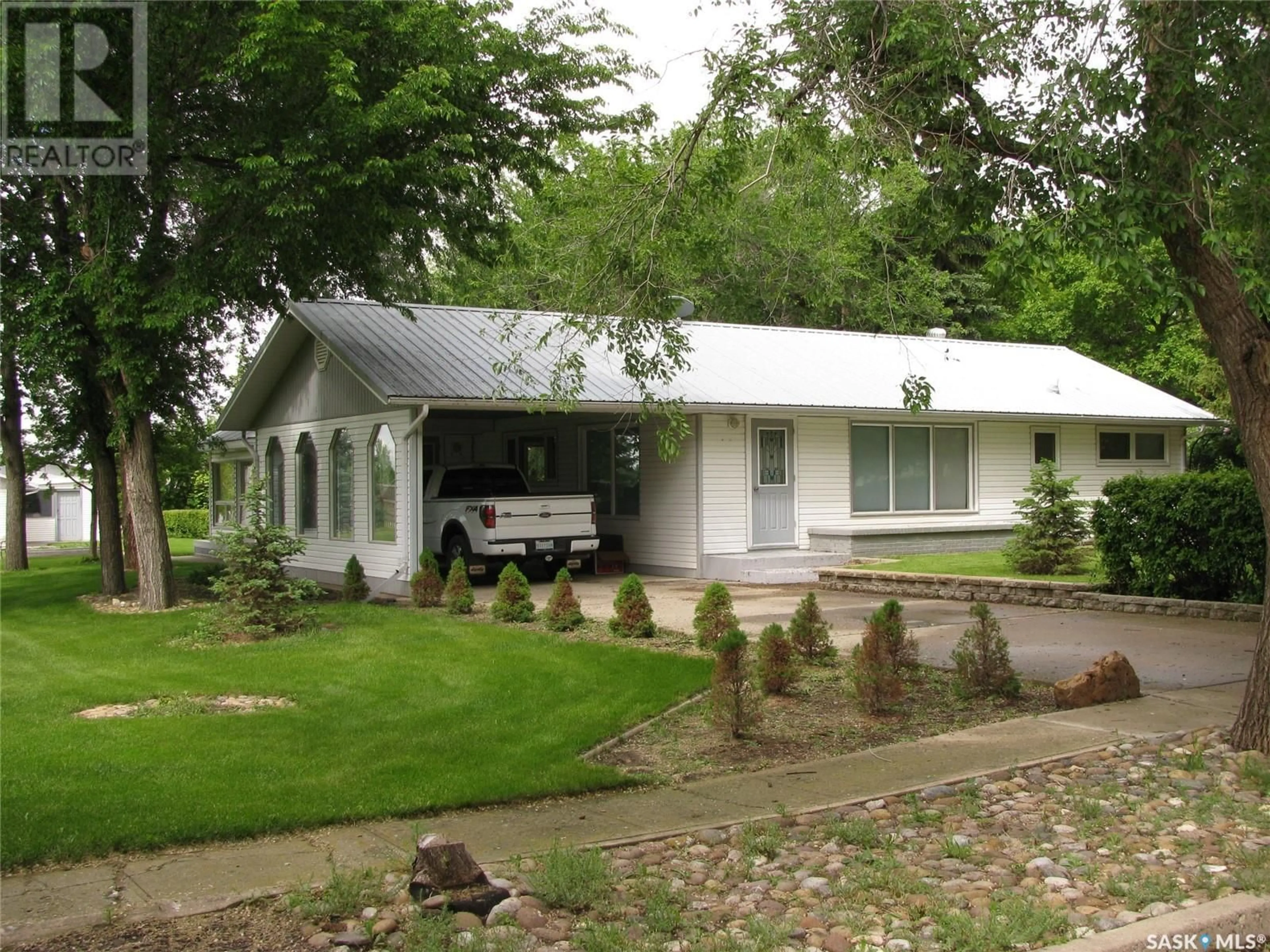 Home with vinyl exterior material, street for 30-31 Main STREET N, St. Victor Saskatchewan S0H3T0