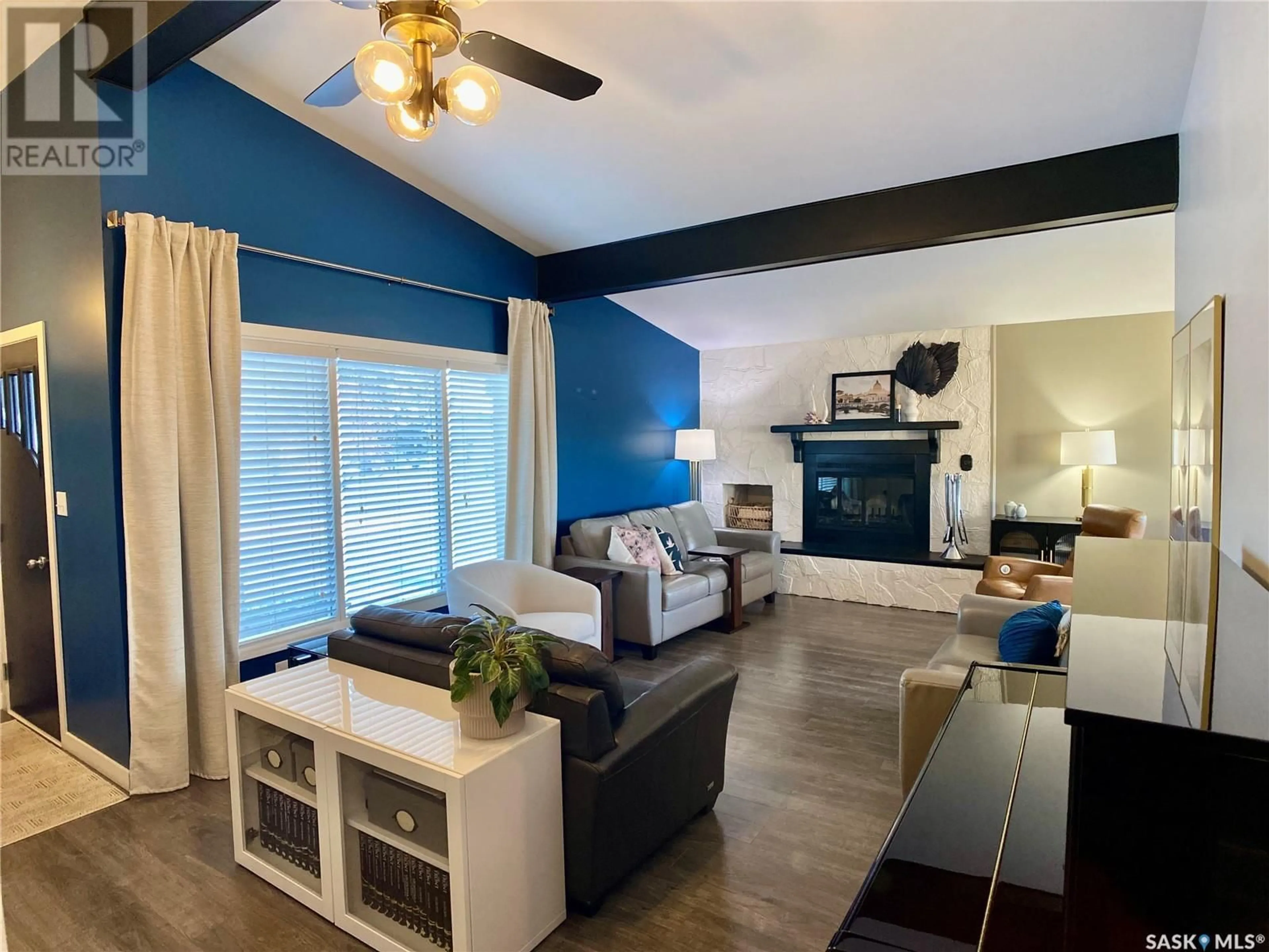 Living room with furniture, wood/laminate floor for 91 MOIR DRIVE, Oxbow Saskatchewan S0C2B0