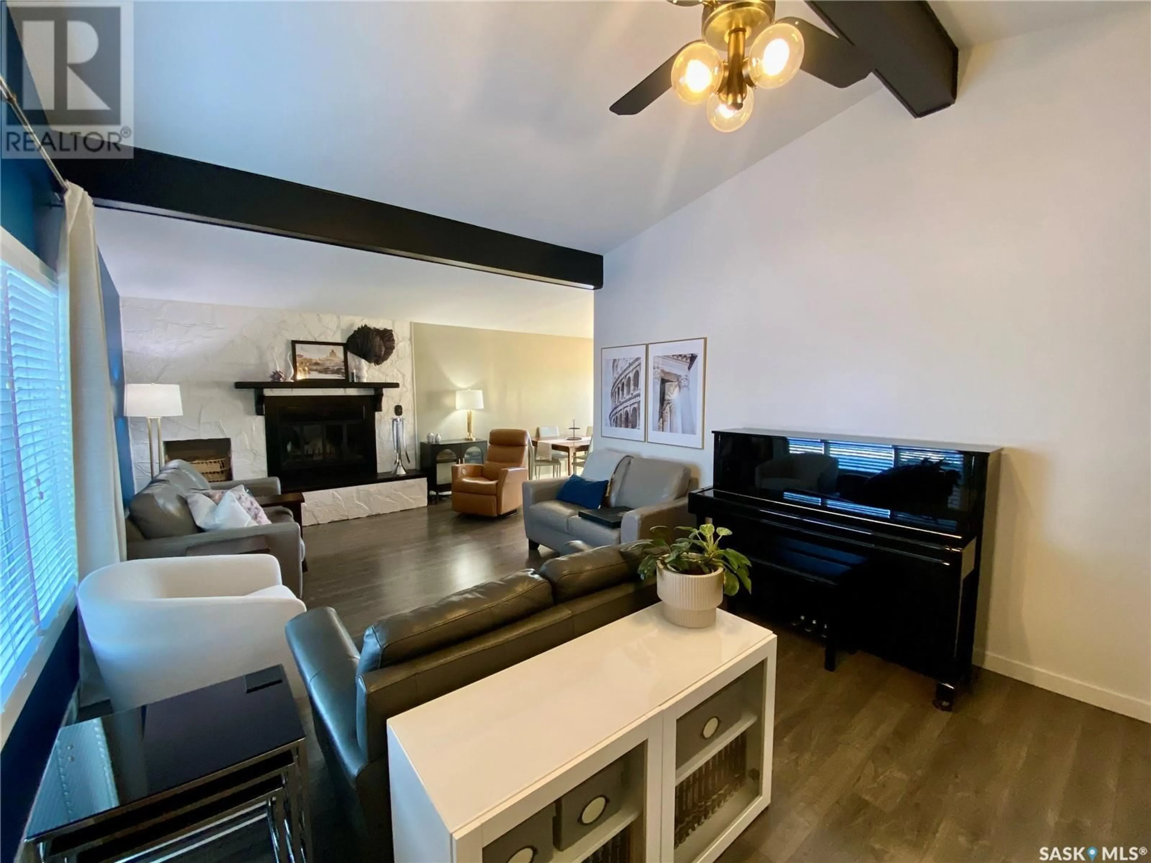 Living room with furniture, wood/laminate floor for 91 MOIR DRIVE, Oxbow Saskatchewan S0C2B0
